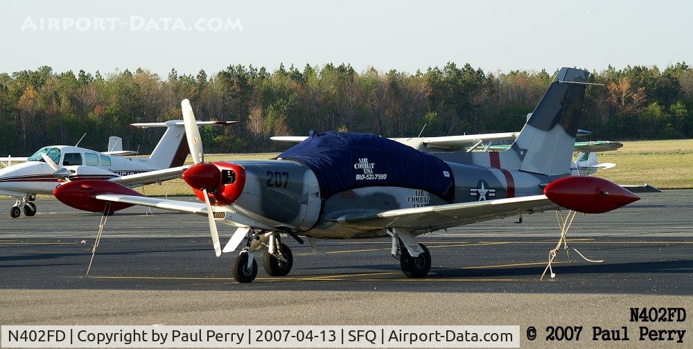 N402FD, 1990 SIAI-Marchetti SF-260D C/N 767, A plane in camo tends to catch your attention on this ramp