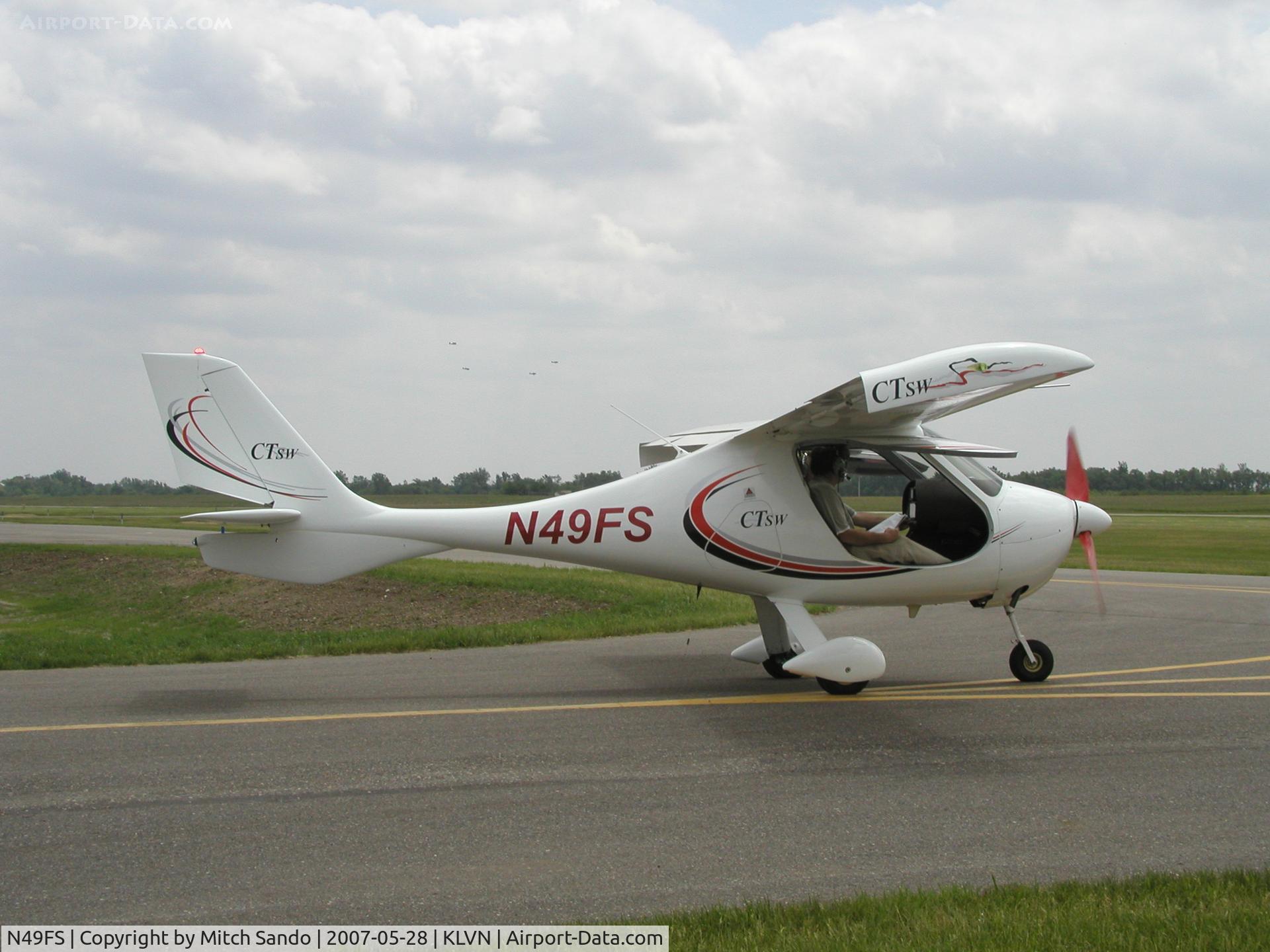 N49FS, 2004 Flight Design CT2K C/N 04-12-09, Flight of 4 T-6's in the background.