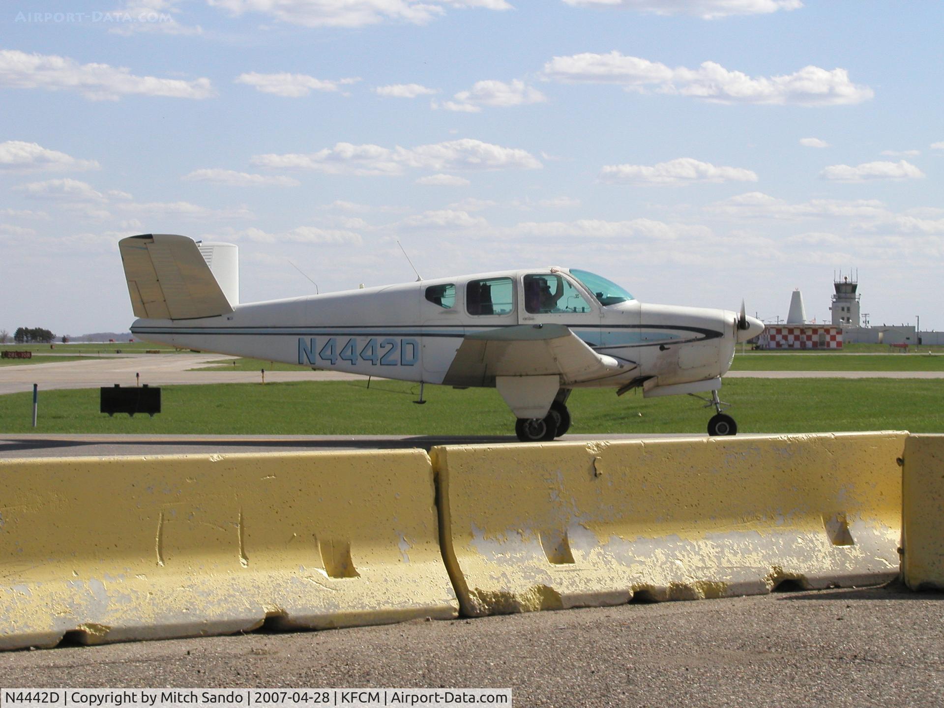 N4442D, 1956 Beech G35 Bonanza C/N D-4534, V-Tail taxiing infront of Thunderbird.