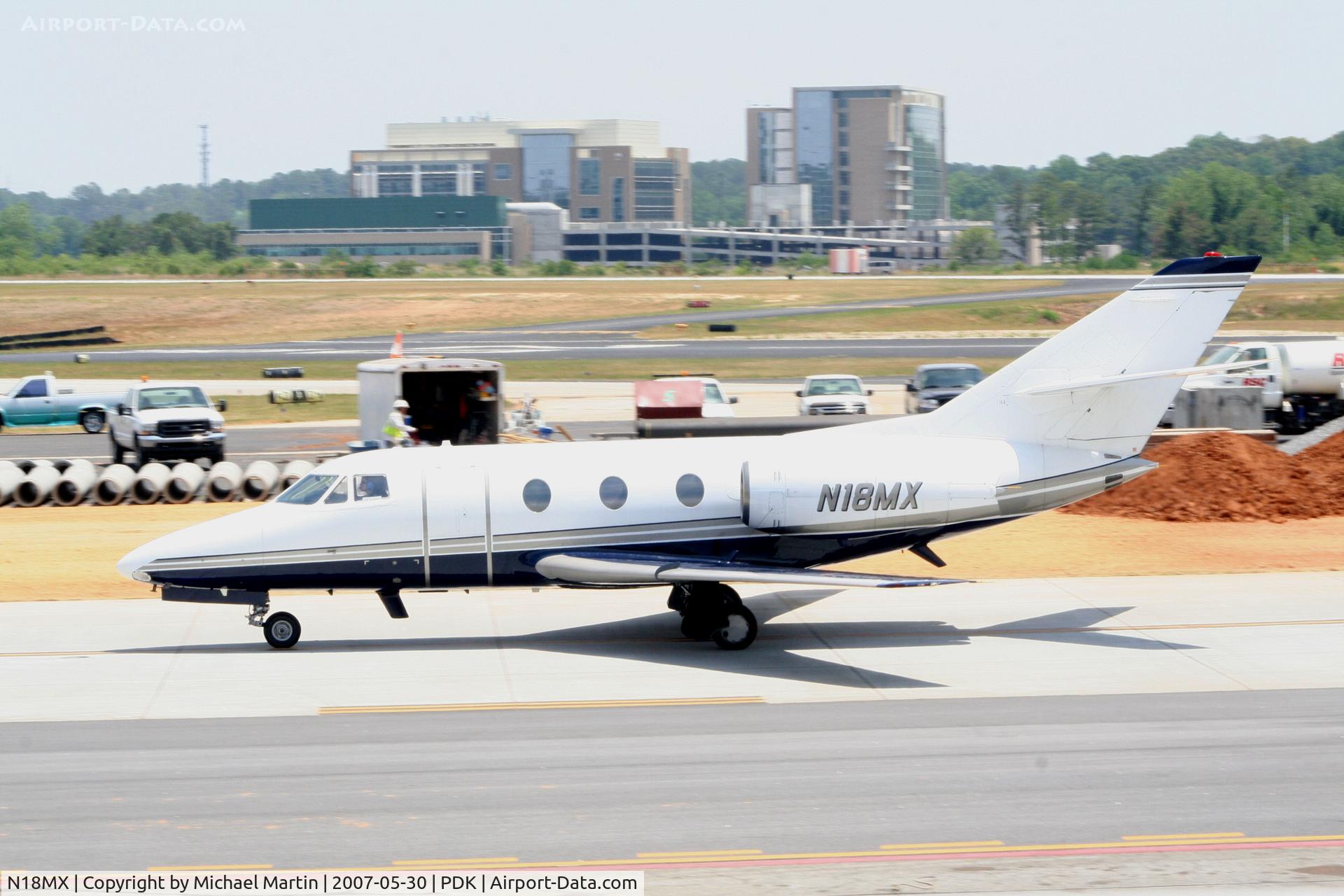 N18MX, 1978 Dassault Falcon 10 C/N 117, Taxing past on going construction