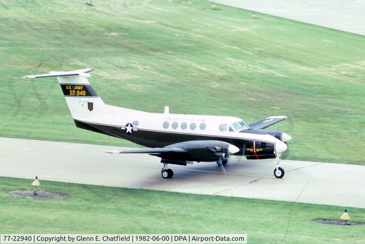 77-22940, Beech C-12C Huron C/N BC-51, C-12A taxiing by the tower.  Became C-12C, then to the State of New Mexico as N48JA