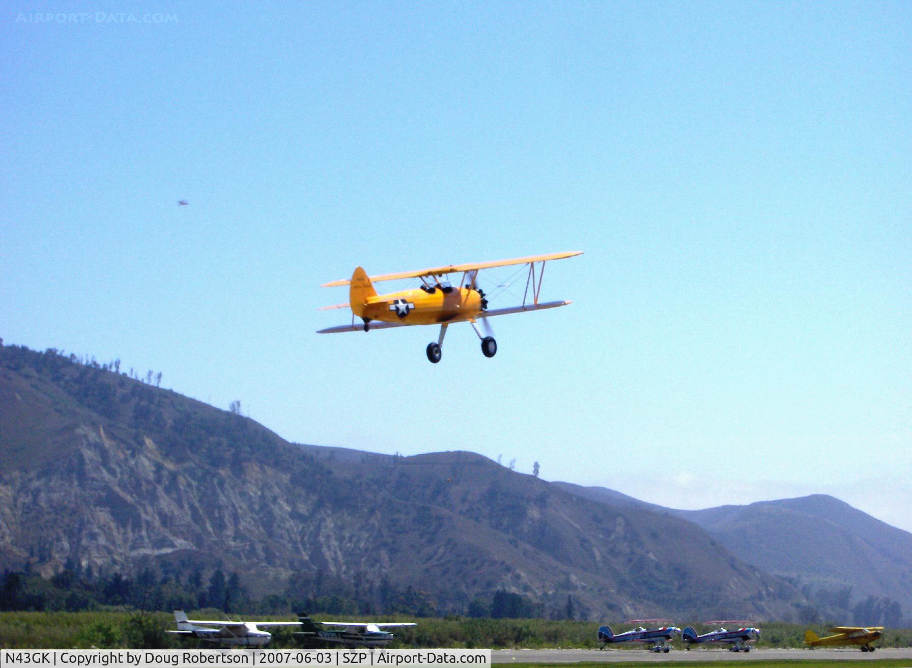 N43GK, 1943 Boeing B75N1 C/N 75-8530, 1943 Boeing Stearman B75N1 as Navy N2S-5, Continental W670 220 Hp, completely restored to absolute original with all stencils and Chrome Yellow paint, takeoff climb Rwy 22 to French Valley Airport, Temecula