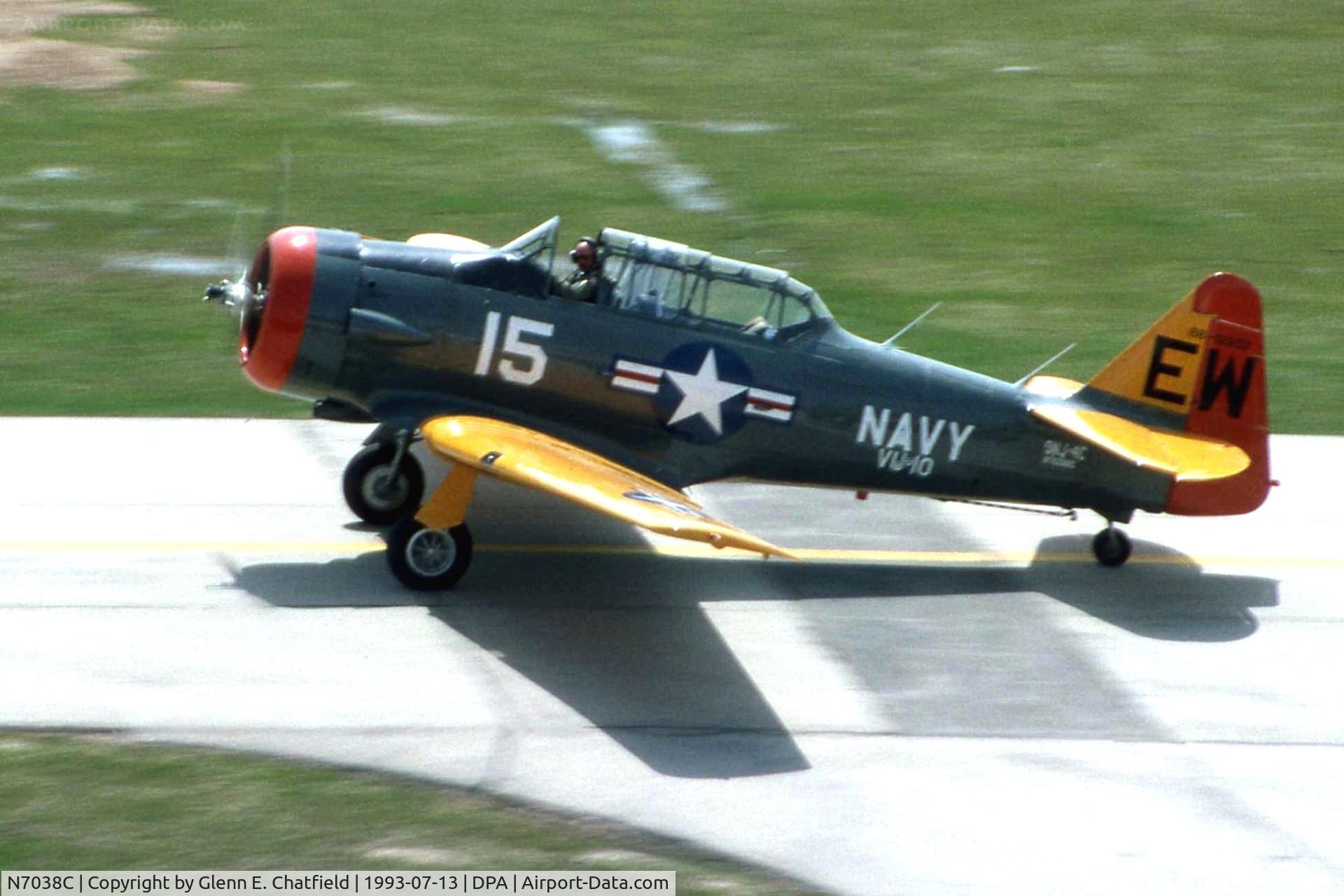 N7038C, 1957 North American SNJ-4 Texan C/N 88-12932, Taxiing by the control tower