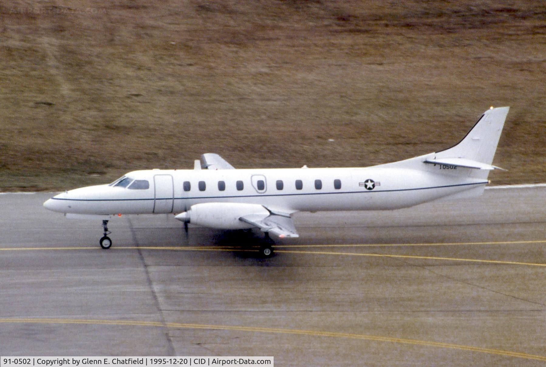 91-0502, 1990 Fairchild Swearingen C-26D Metro III C/N DC-801M, C-26D taxiing past the control tower.  Hot film left brown haze