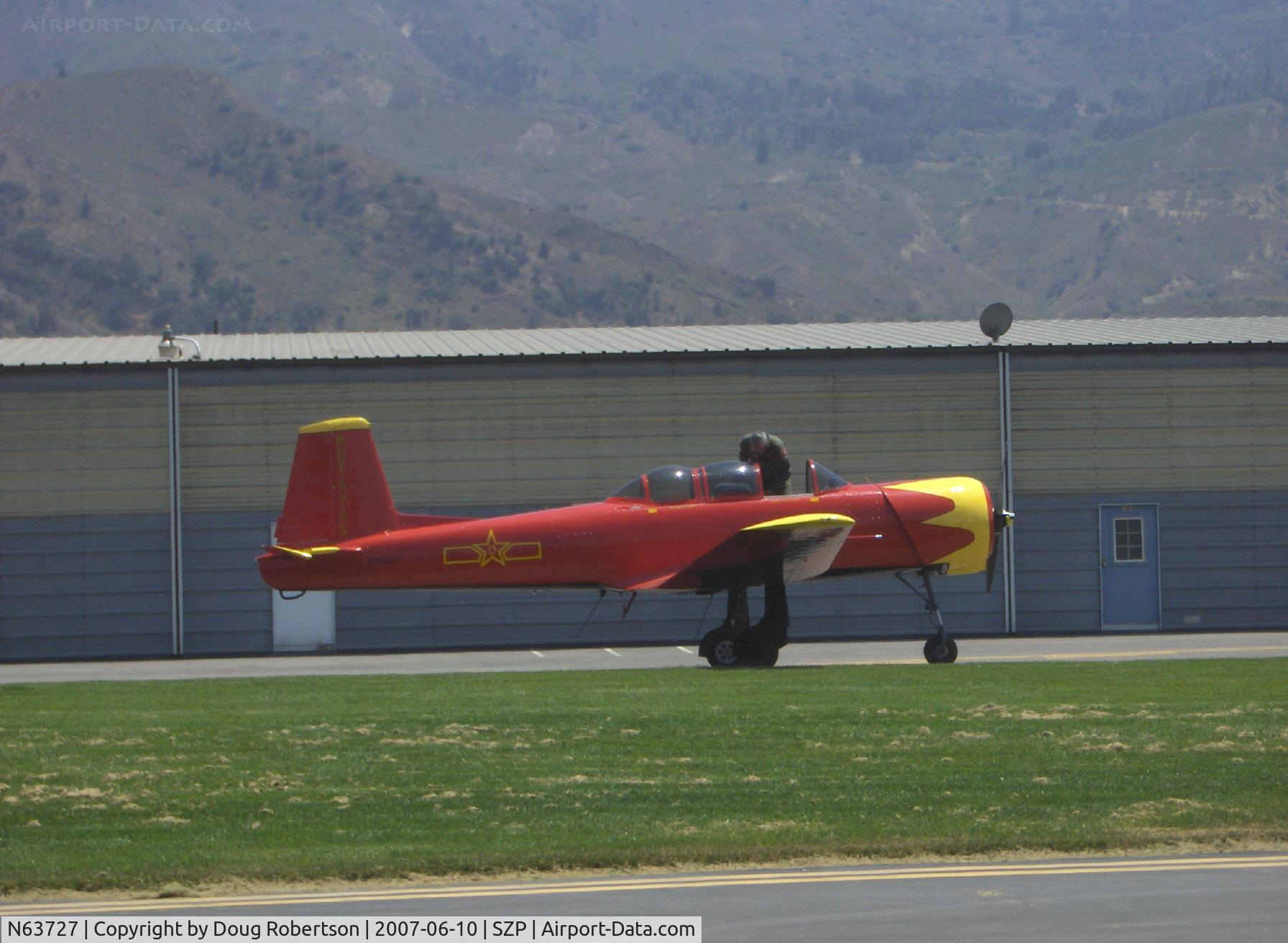 N63727, 1977 Nanchang CJ-6A C/N 1832035, 1977 Nanchang China CJ-6A as NX63727, Huosai 6A 9 cylinder radial 285 Hp, pilot wears helmet