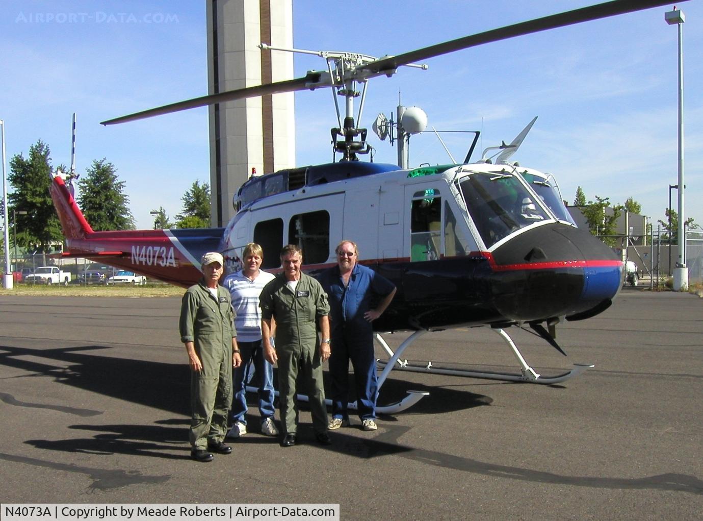 N4073A, 1969 Bell UH-1H Iroquois C/N 69-15075, Col. Roberts, Ret. (L) & the delivery crew
