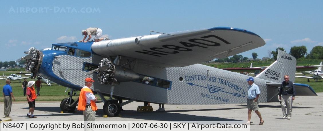 N8407, 1929 Ford 4-AT-E Tri-Motor C/N 69, Giving rides at the Sandusky, OH fly-in.  Checking something out, I guess.