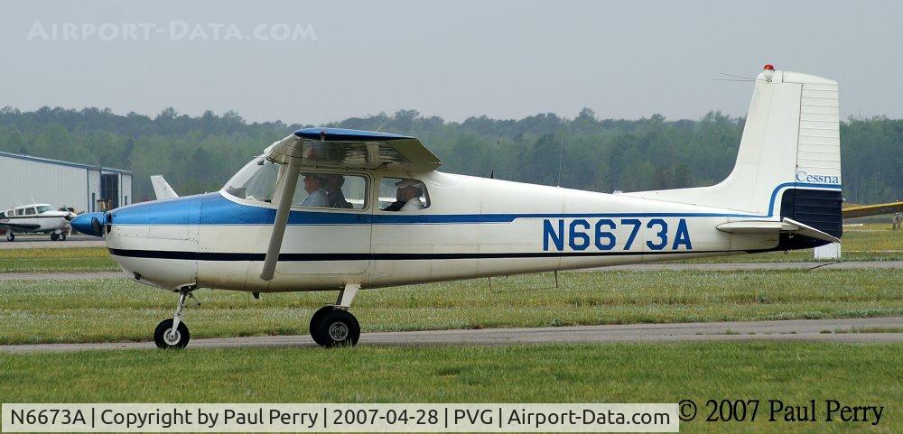N6673A, 1956 Cessna 172 C/N 28773, Taxiing in under a fleeting break in the clouds