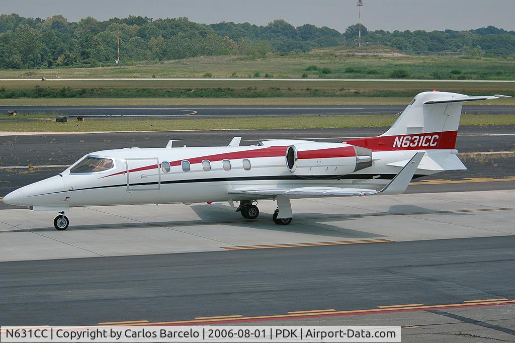 N631CC, 1995 Learjet Inc 31A C/N 104, Passing by the observation deck at PDK.