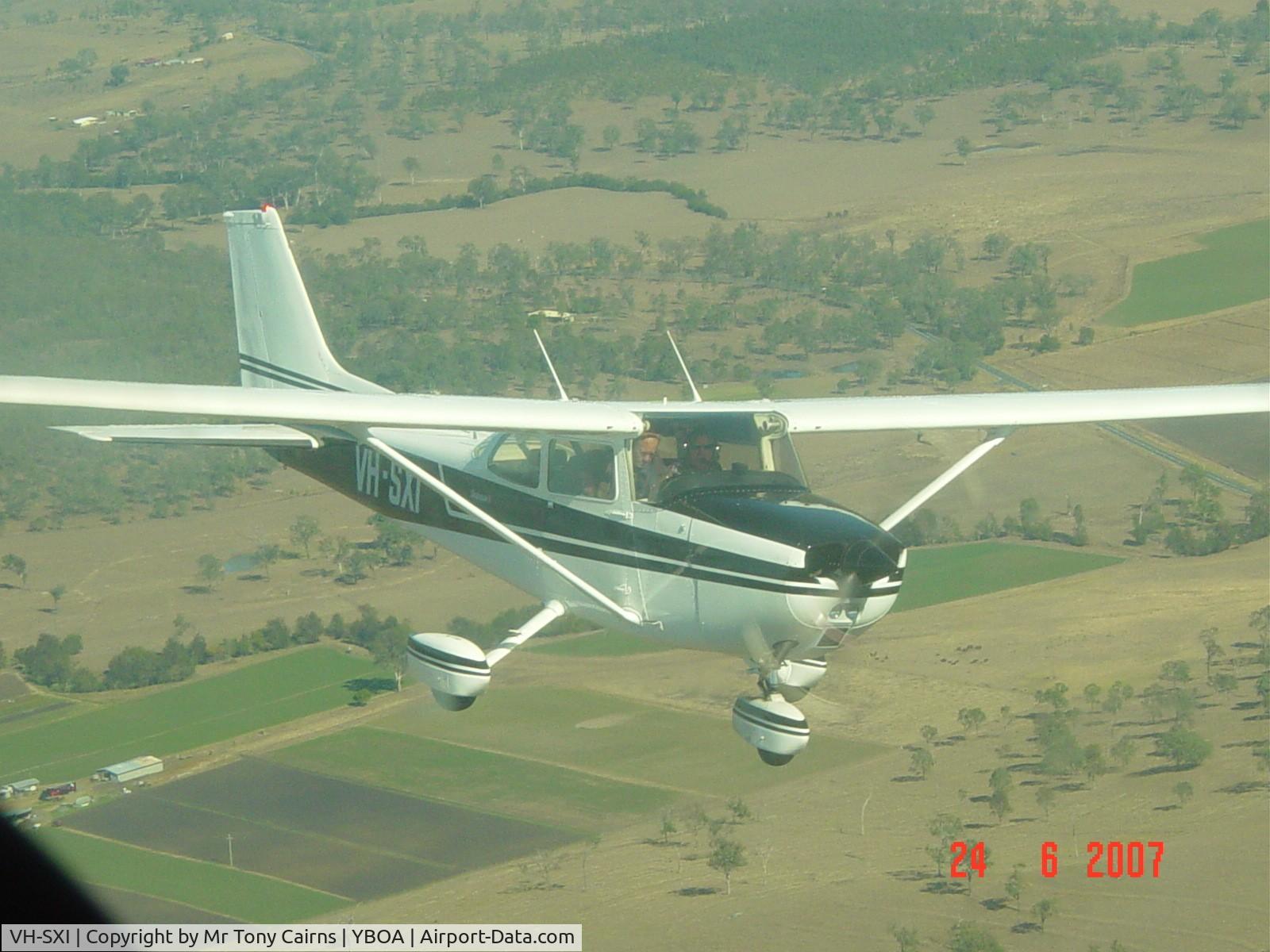 VH-SXI, 1976 Cessna 172M C/N 17267509, VH-SXI formating on VH-RRG to take some aerial shots.