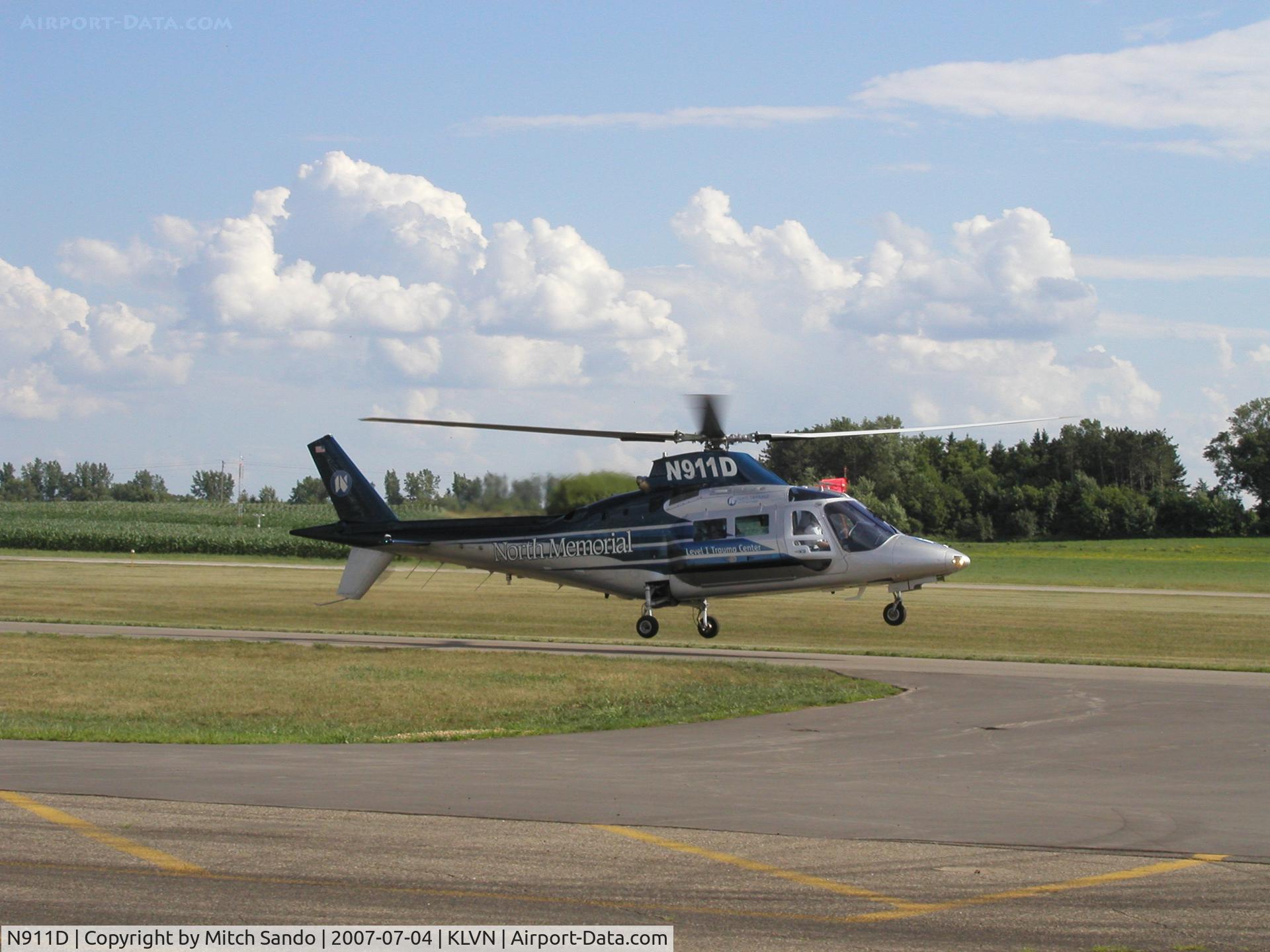 N911D, Agusta A-109C Max C/N 7637, Air Care 1 landing on the parallel taxiway to Runway 30 with some new paint.