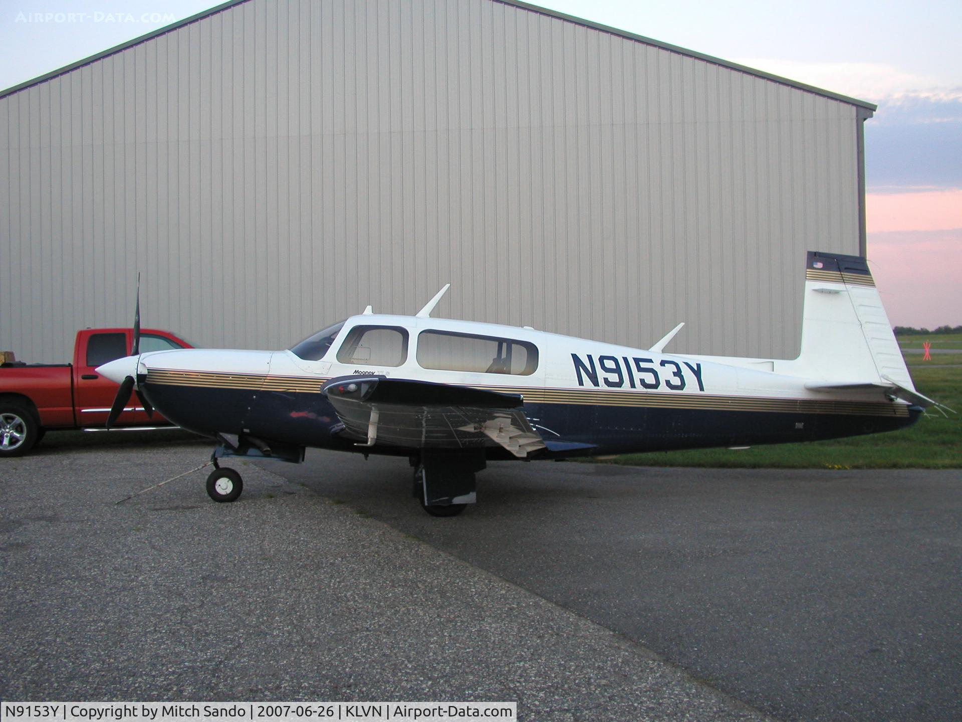 N9153Y, 1991 Mooney M20M Bravo C/N 27-0125, Mooney parked infront of the Wentworth Aircraft hangar at Airlake.