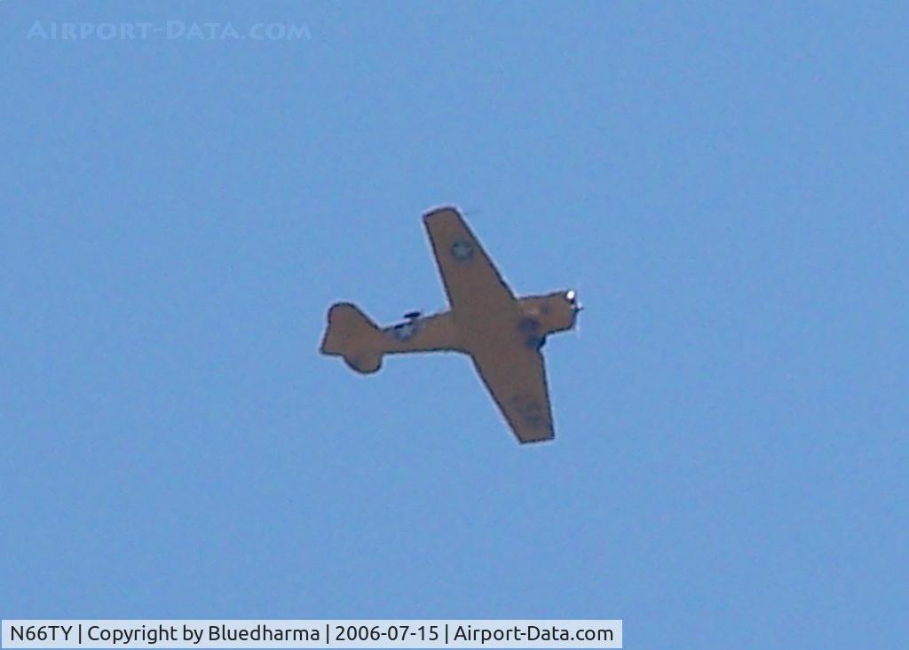 N66TY, North American T-6G Texan C/N 168-142, Flying over Columbine High School