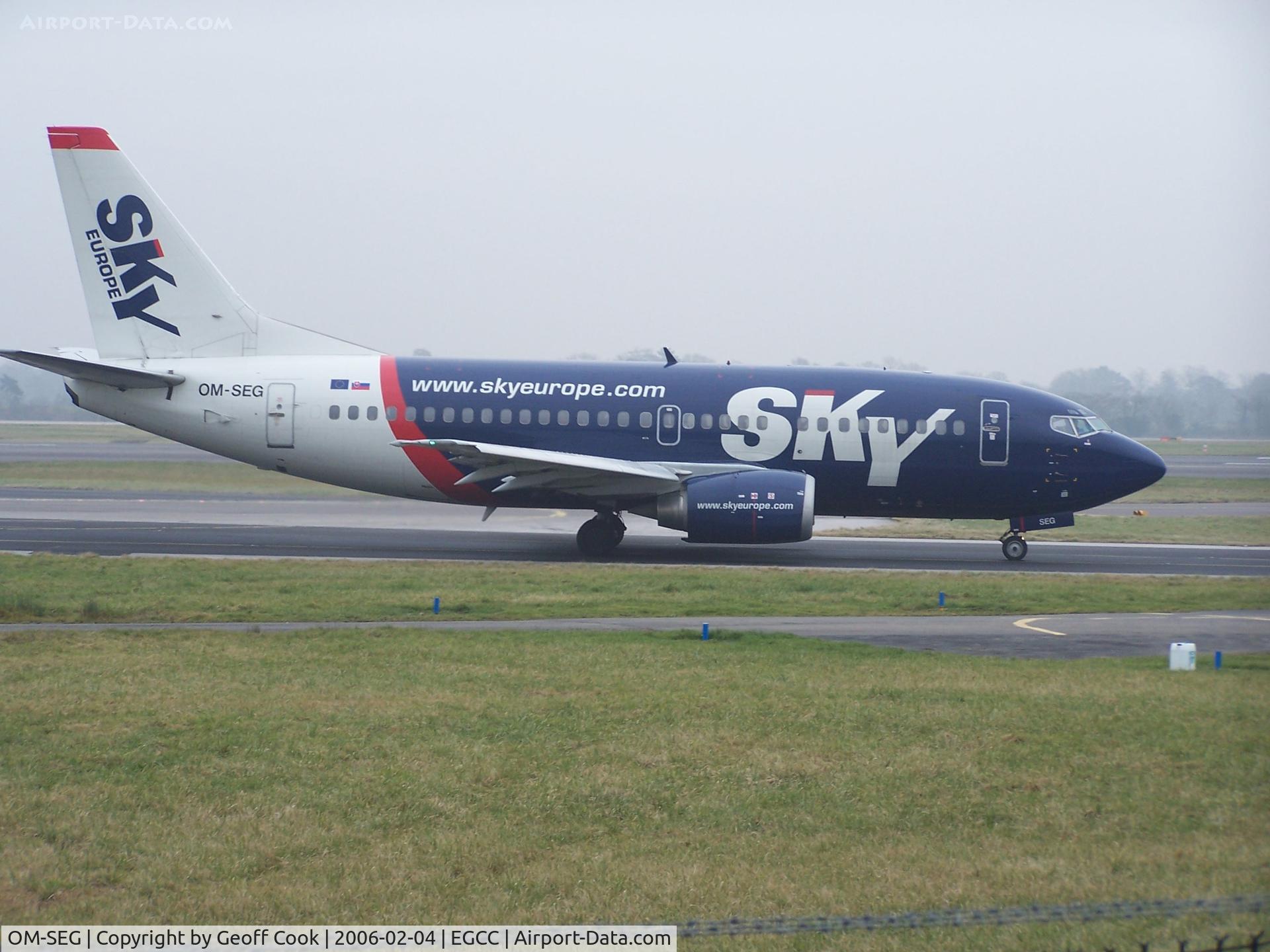 OM-SEG, 1992 Boeing 737-5Y0 C/N 25289, Sky Europe 737 OM-SEG taxis past the Manchester Airport viewing park