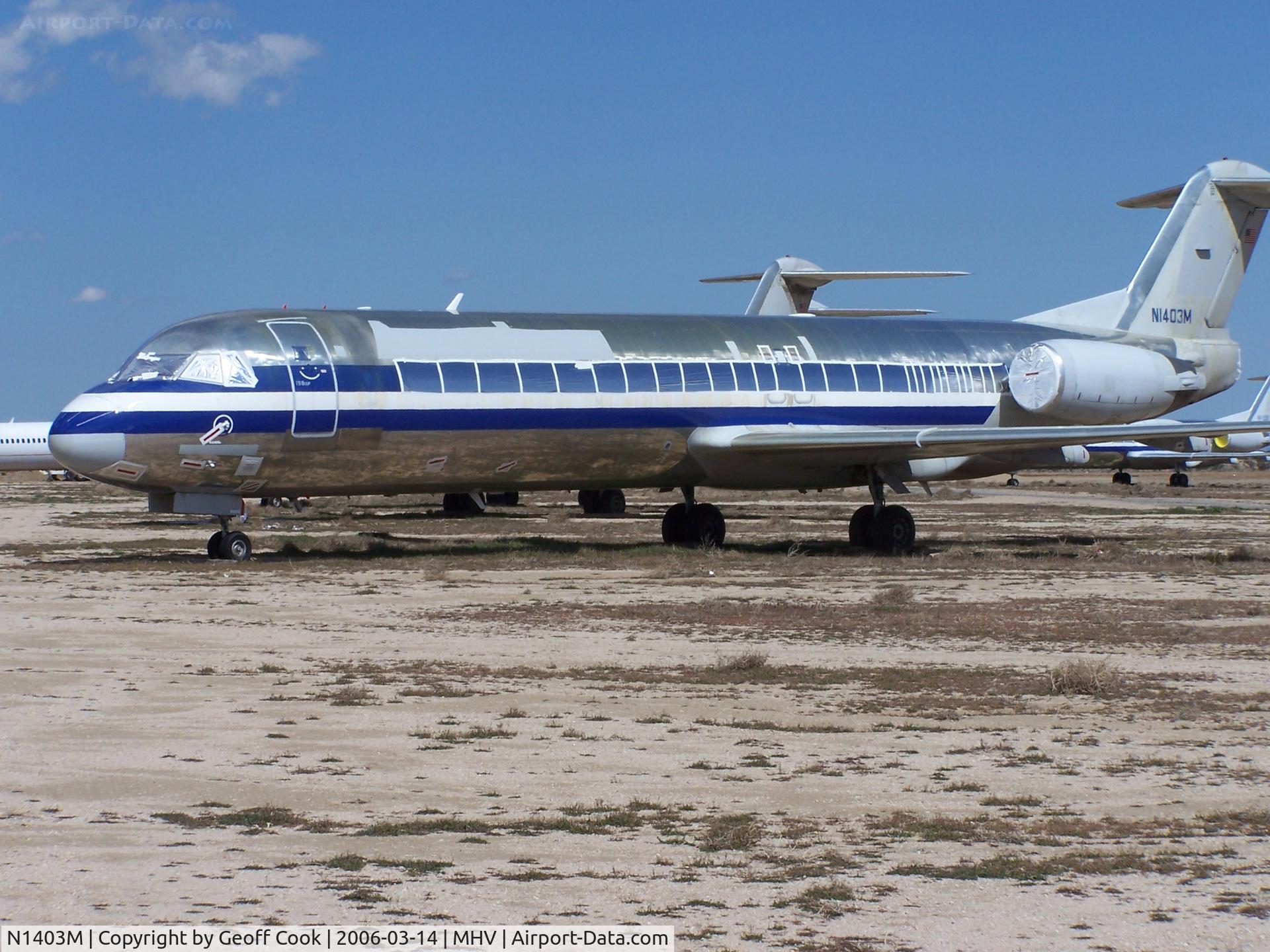 N1403M, 1992 Fokker 100 (F-28-0100) C/N 11354, Retired by American following the 2001 terror attacks in the USA, most of American's Fokker 100s are in service with other airlines. On not so lucky aircraft N1403M sits in the baking sun at Mojave March 2003