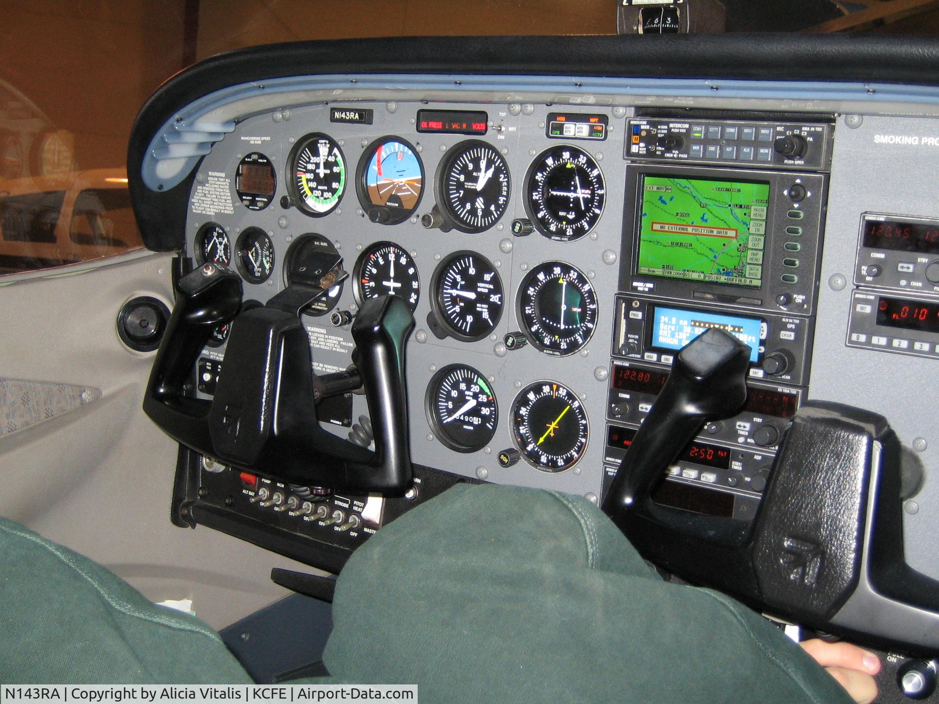 N143RA, 1999 Cessna 172S C/N 172S8314, Instrument panel.  Paul's poking around underneath