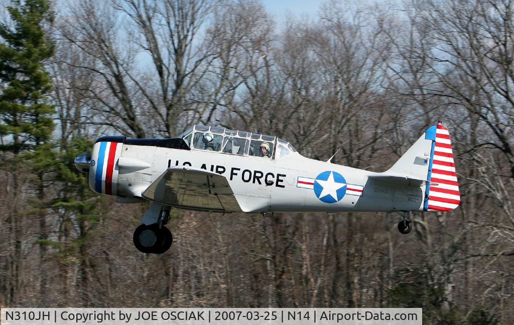 N310JH, 1953 North American T-6G Texan C/N 88-12472, Leaving The Flying W