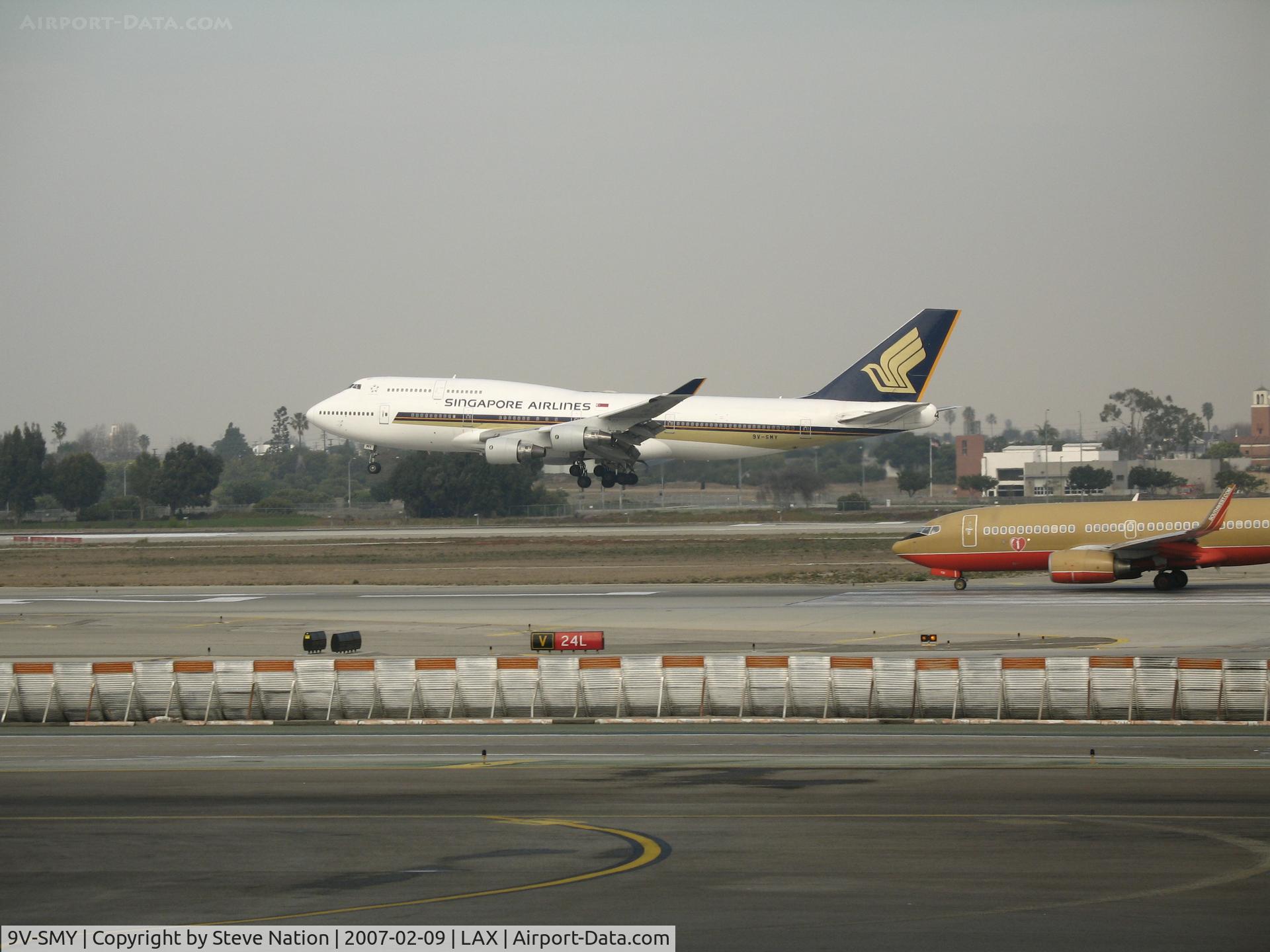 9V-SMY, 1994 Boeing 747-412 C/N 27217, Singapore Airlines 747-412 touching down @ LAX