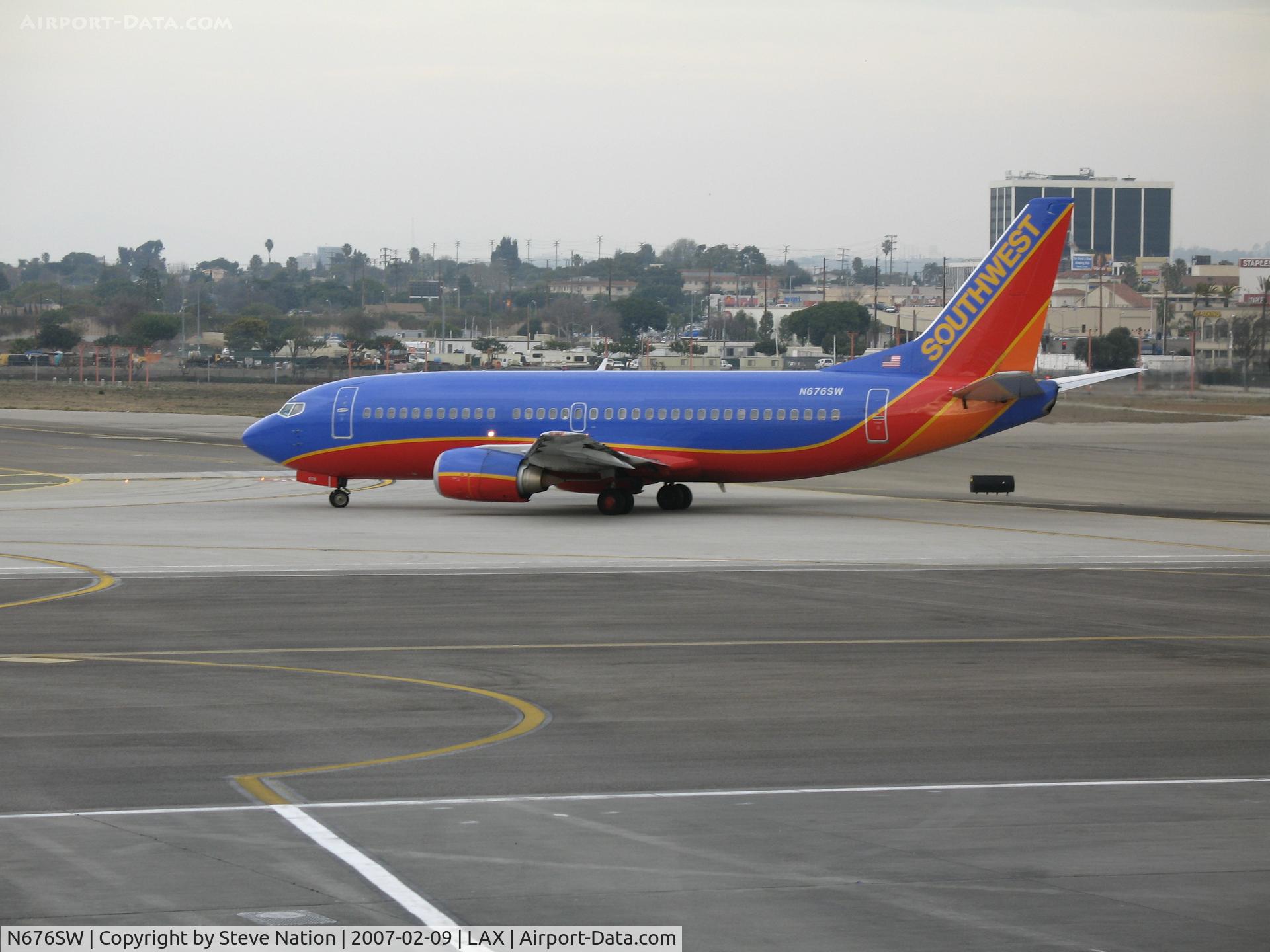 N676SW, 2000 Boeing 737-3A4 C/N 23288, Southwest 737-3A4 in new colors taxying @ LAX