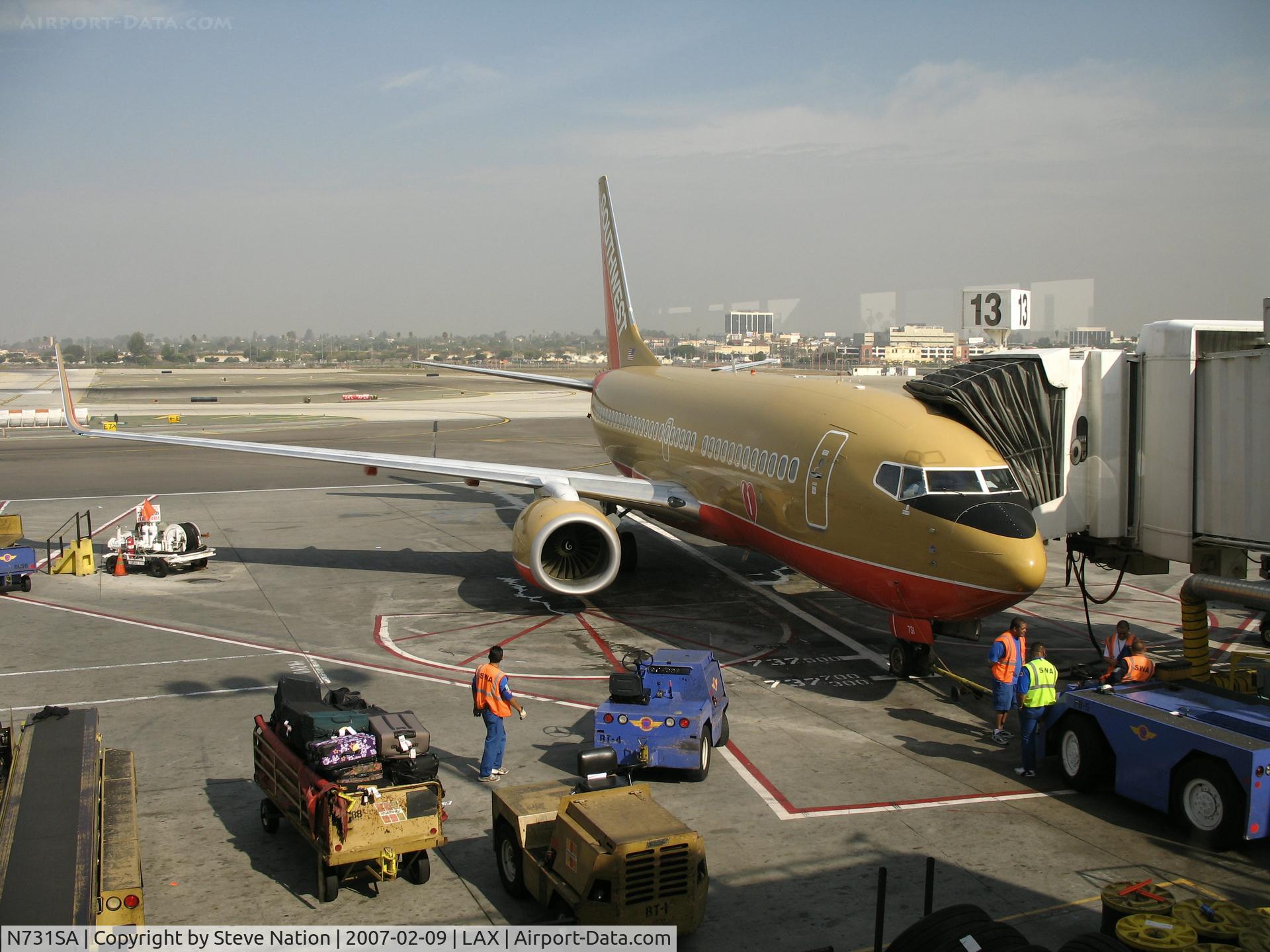 N731SA, 1999 Boeing 737-7H4 C/N 27863, Southwest 737-7H4 in old colors and winglets at gate  @ LAX