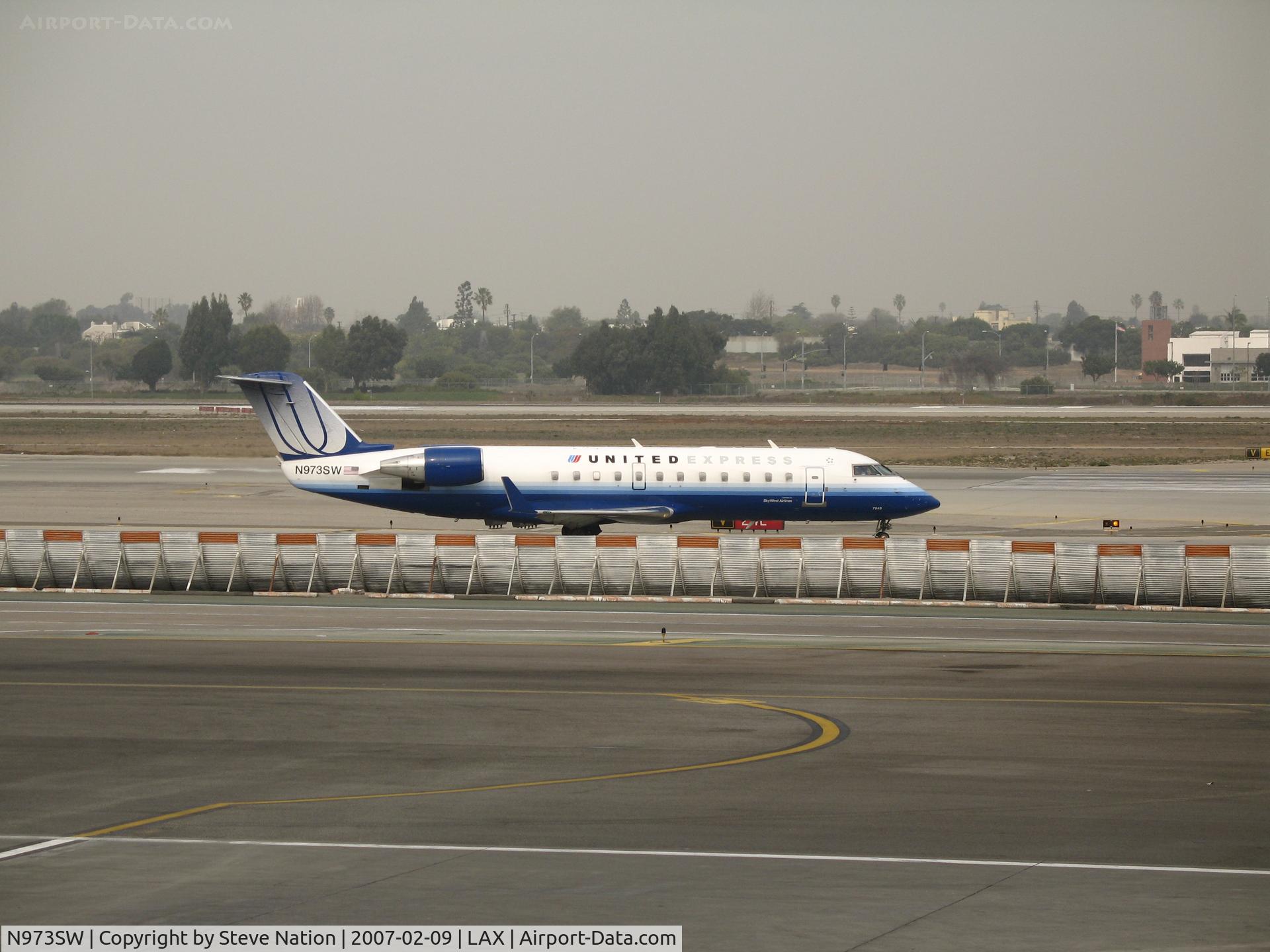N973SW, 2004 Bombardier CRJ-200ER (CL-600-2B19) C/N 7949, United Express CL-600-2B19 in new colors taxying @ LAX