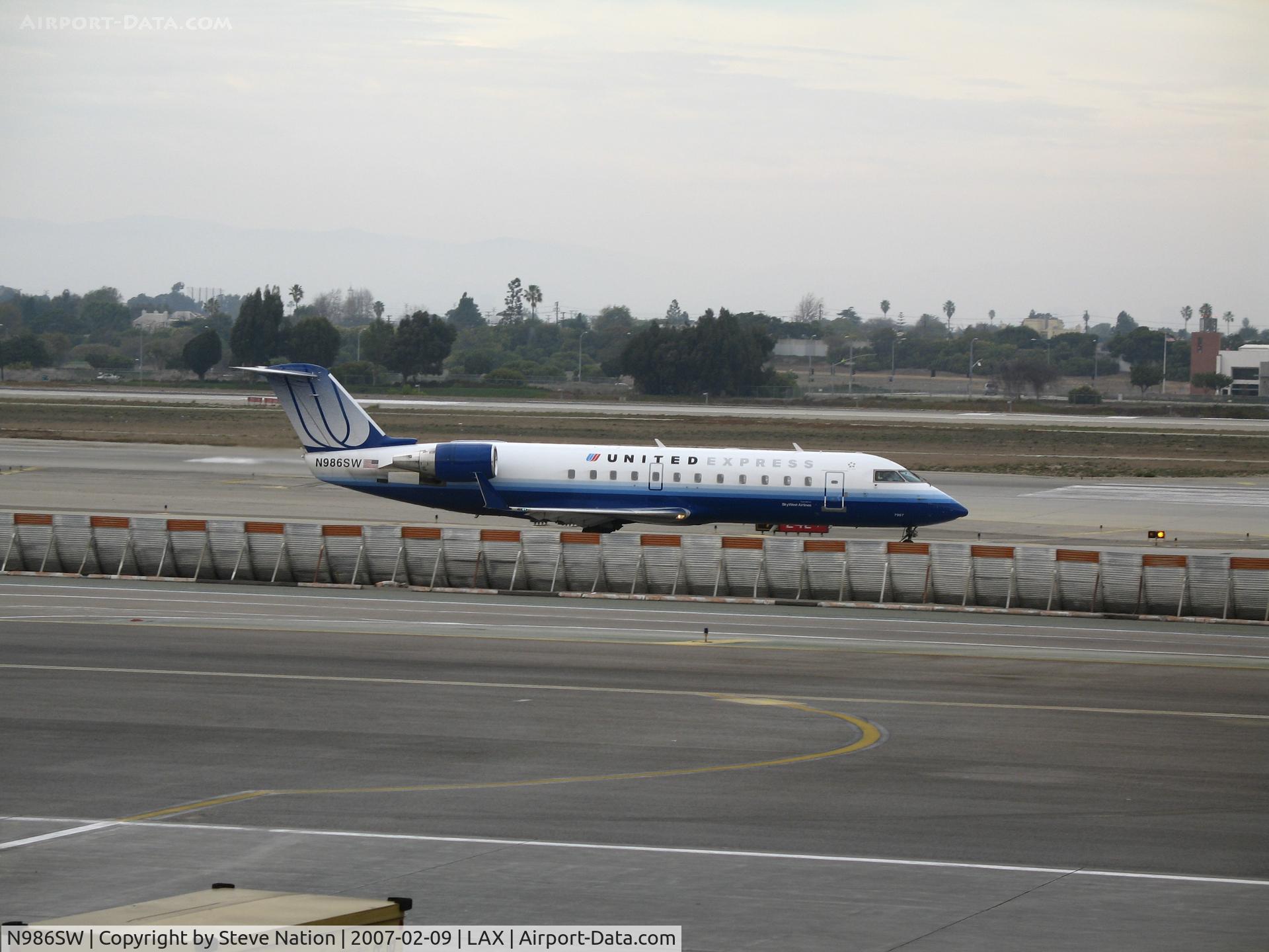 N986SW, 2004 Bombardier CRJ-200ER (CL-600-2B19) C/N 7967, United Express CL-600-2B19 in new colors taxying @ LAX