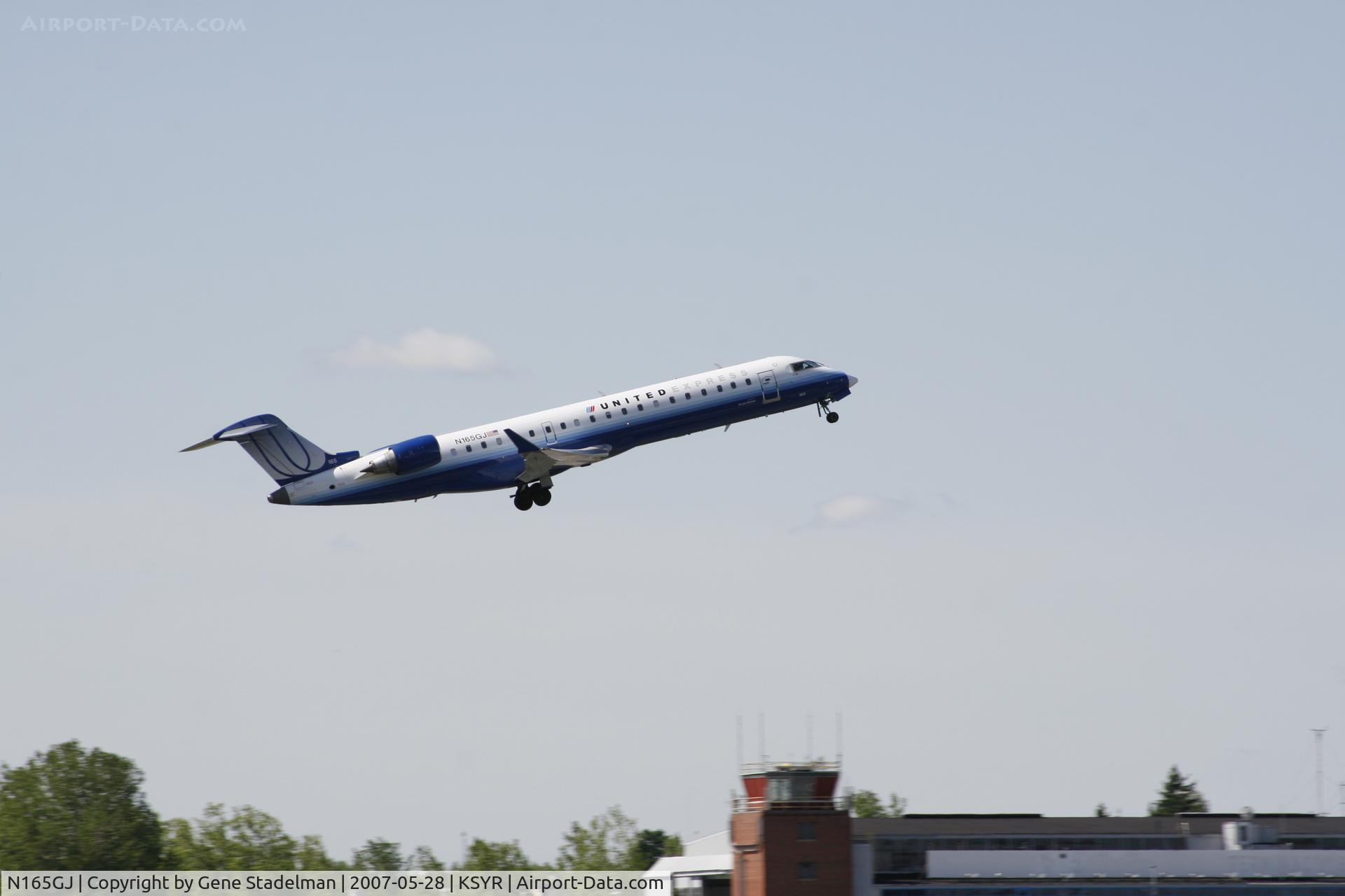 N165GJ, 2006 Bombardier CRJ-700 (CL-600-2C10) Regional Jet C/N 10257, Takeoff/Notice what I believe to be the original tower in the background.