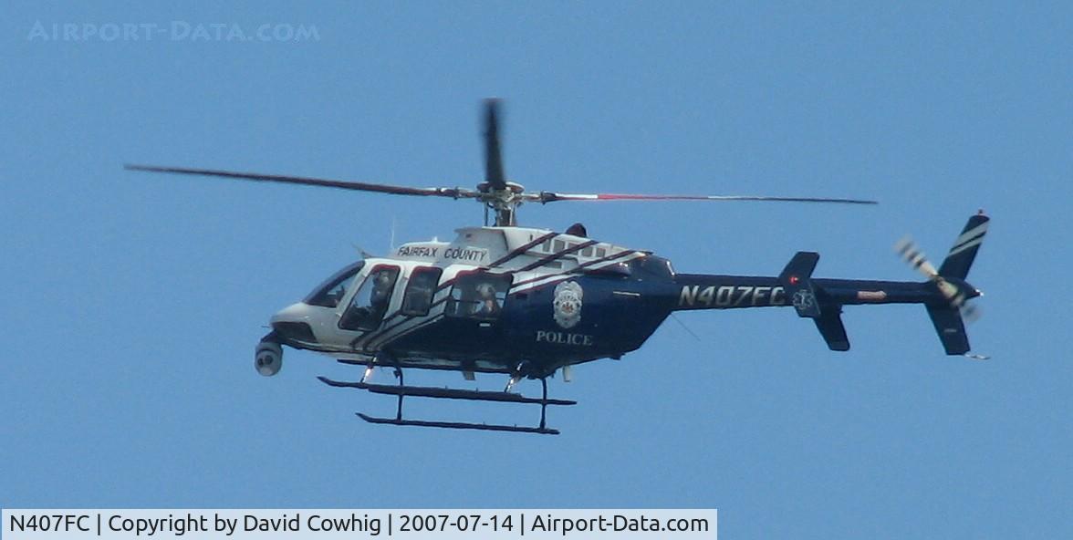 N407FC, 1996 Bell 407 C/N 53050, Fairfax County Police helicopter circled several times over my yard sale, July 14, 2007.