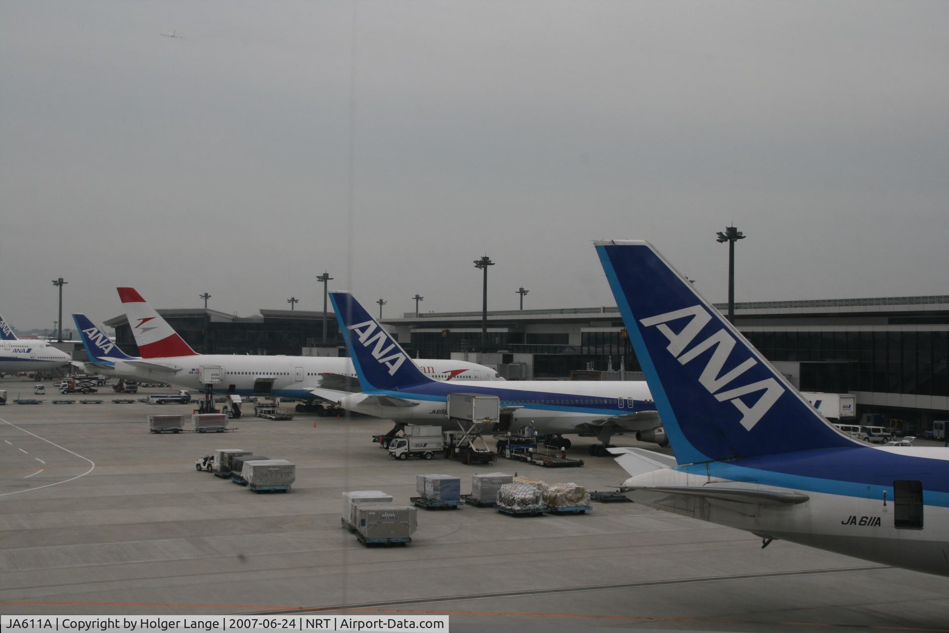 JA611A, 2003 Boeing 767-381/ER C/N 32980, Tail section together with JA615A in NRT