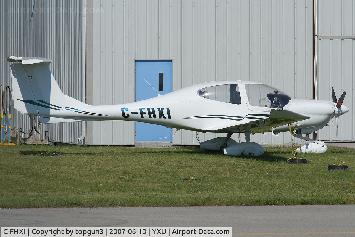 C-FHXI, 2002 Diamond DA-40 Diamond Star C/N 40.216, Parked by XU Aviation hangar.