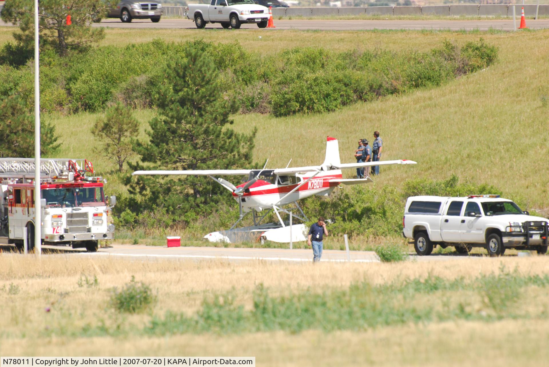 N78011, 1979 Cessna A185F Skywagon 185 C/N 18503902, Sitting at the field, saw this one land, Park at Tac-Air, and then take off about 45 minutes later. Tower cleared them for a South Departure, but they never climbed out behind the buildings. Fortunately no injury or fatalities, only a dented airplane