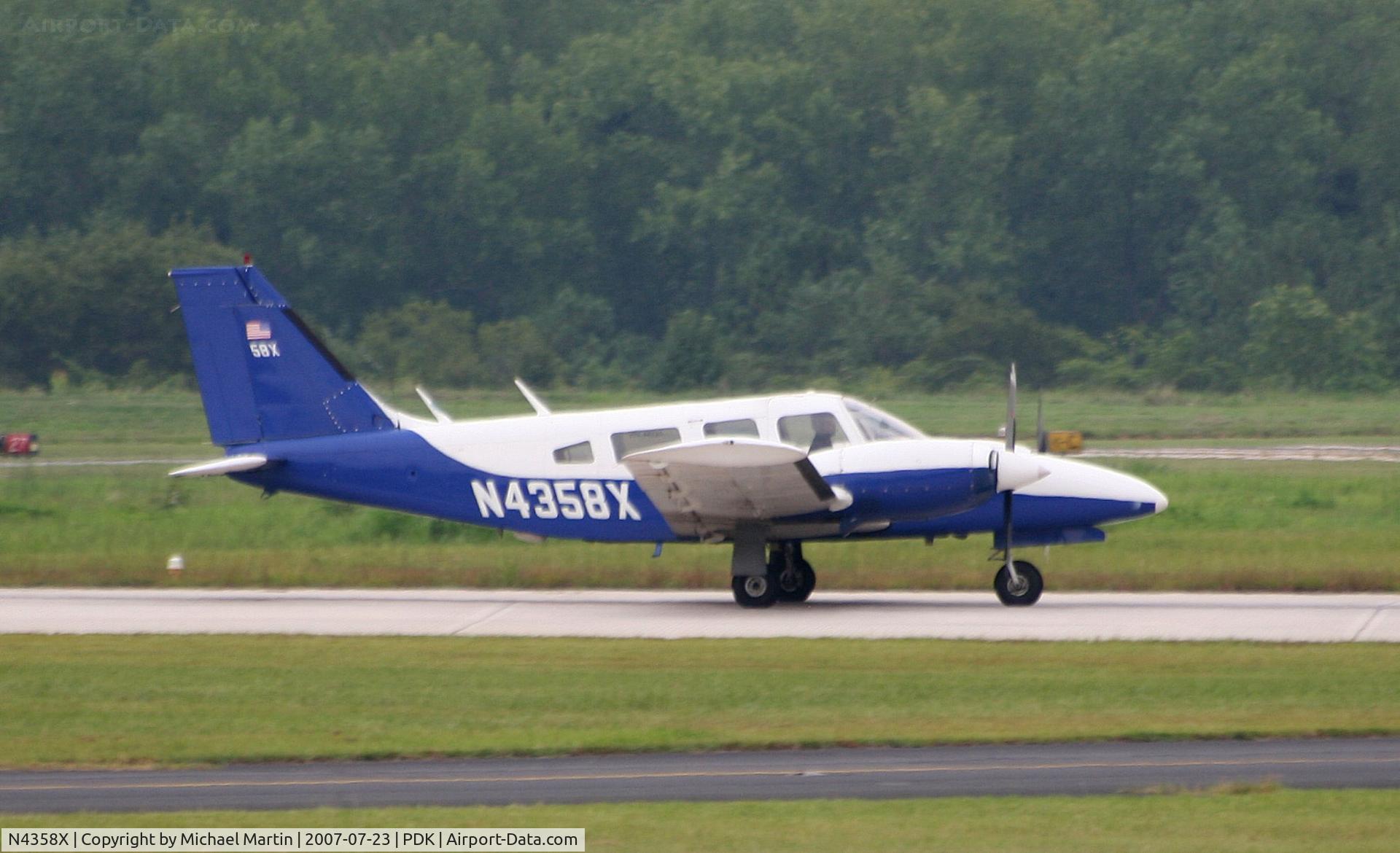 N4358X, 1975 Piper PA-34-200T C/N 34-7670027, Landing Runway 20L