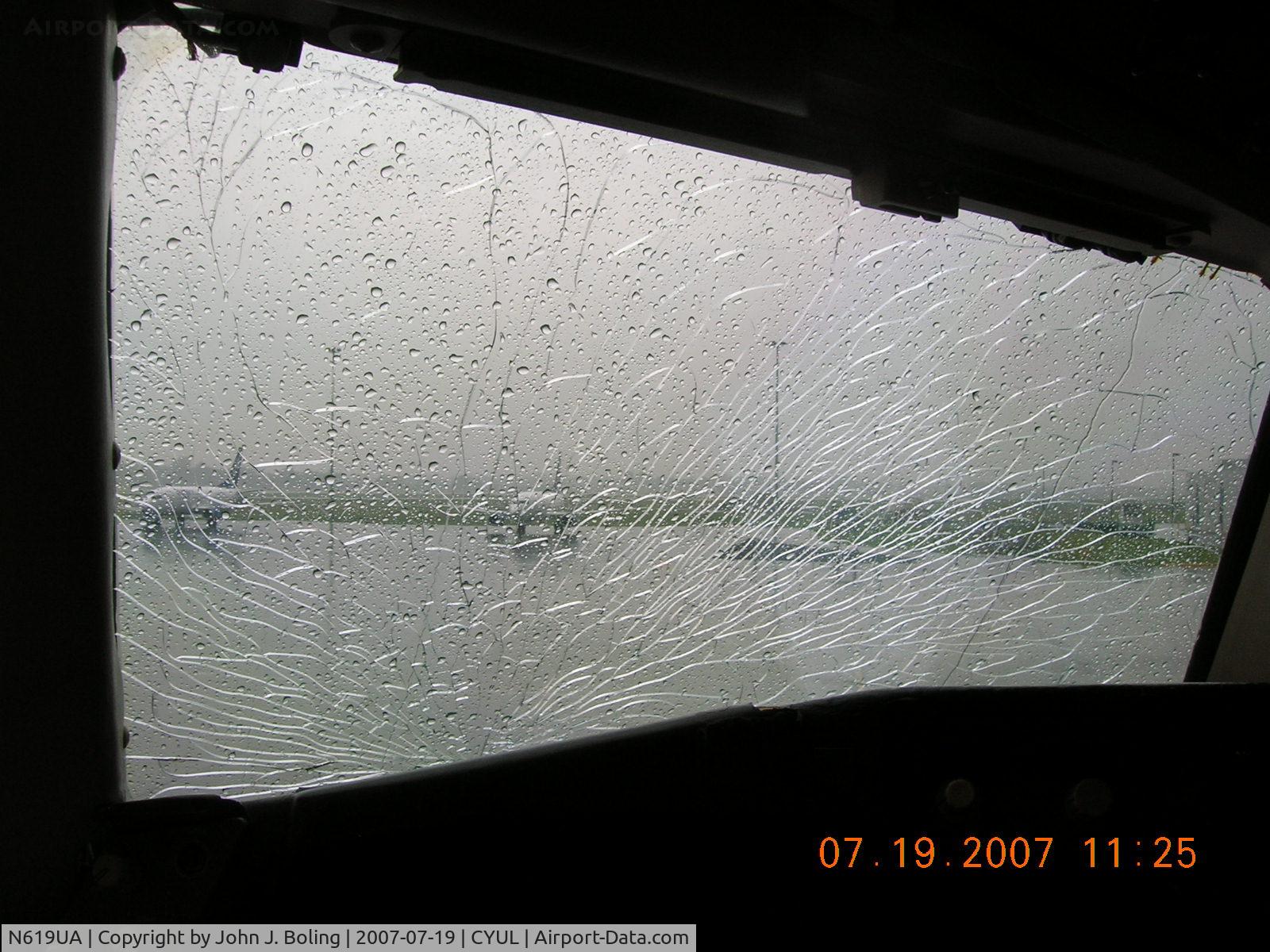 N619UA, 1983 Boeing 767-222 C/N 21879, Veiw thru captains windshield after divert into CYUL. Aircraft was in cruise at FL270, M.80 approx 100nm north of YUL when outer pane shattered. Ferry to Kabul continued next day after replacement.
