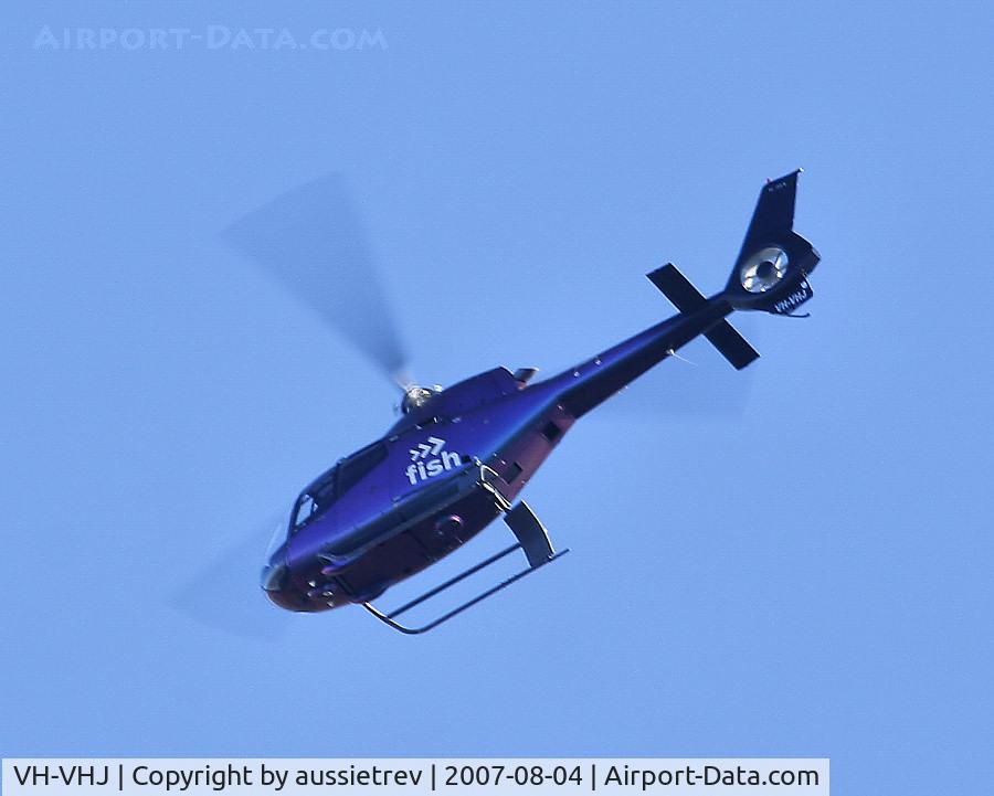 VH-VHJ, 2002 Eurocopter EC-120B Colibri C/N 1300, Heading South-West over Gold Coast about 20k from Brisbane. Registered to ROTHMONT PROJECTS PTY LTD, the FISH logo is for a chain of liquor outlets