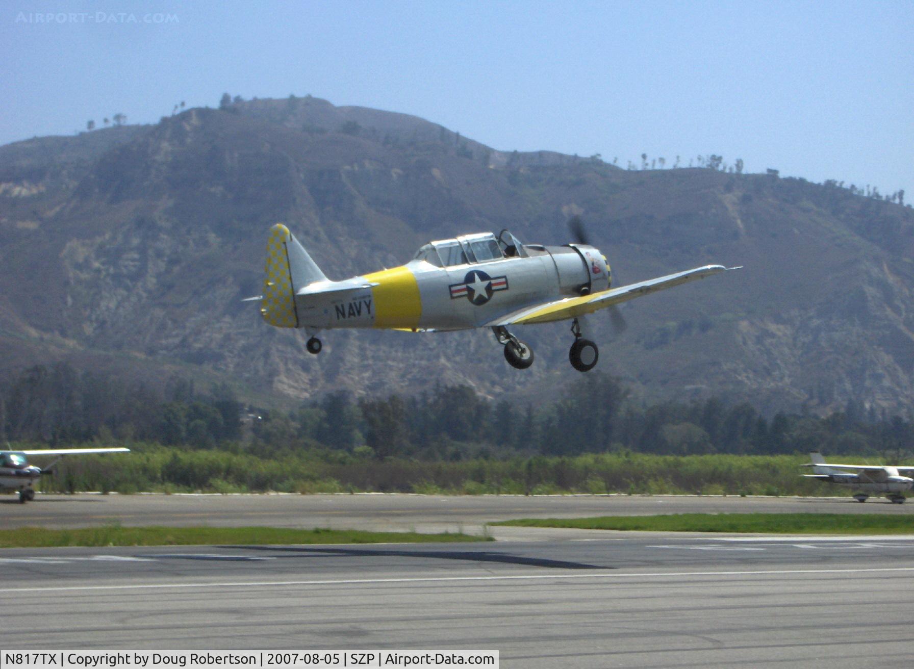 N817TX, 1942 North American AT-6D Texan C/N 88-18022 (42-86241), 1942 North American AT-6D TEXAN 'Problem Child', P&W R-1340 600 Hp, gear coming up over Rwy 22