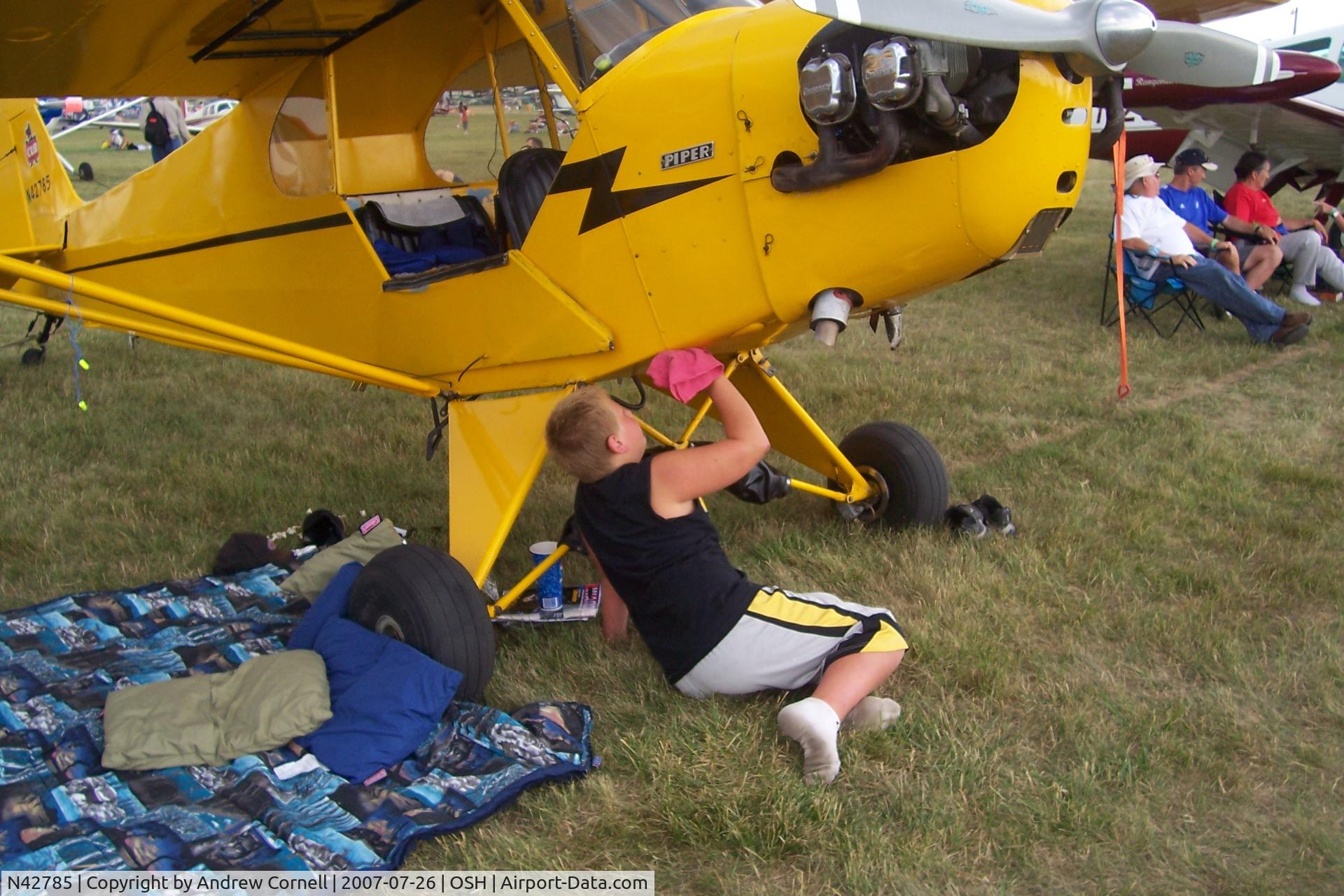 N42785, 1945 Piper J3L-65 Cub C/N 15099, Cleaning it up - paying for his ride!