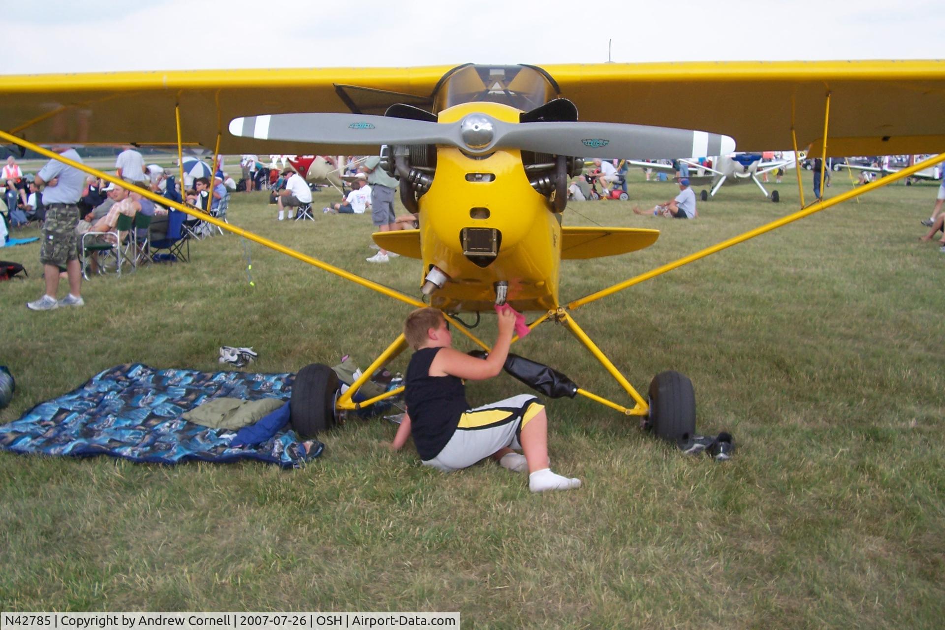 N42785, 1945 Piper J3L-65 Cub C/N 15099, Cleaning it up - paying for his ride!