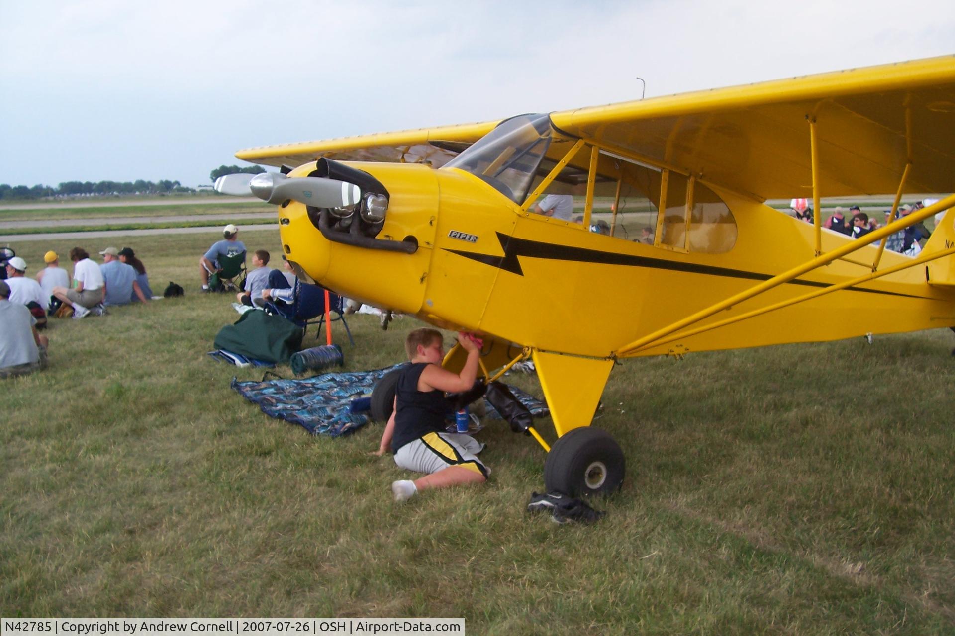 N42785, 1945 Piper J3L-65 Cub C/N 15099, Cleaning it up - paying for his ride!