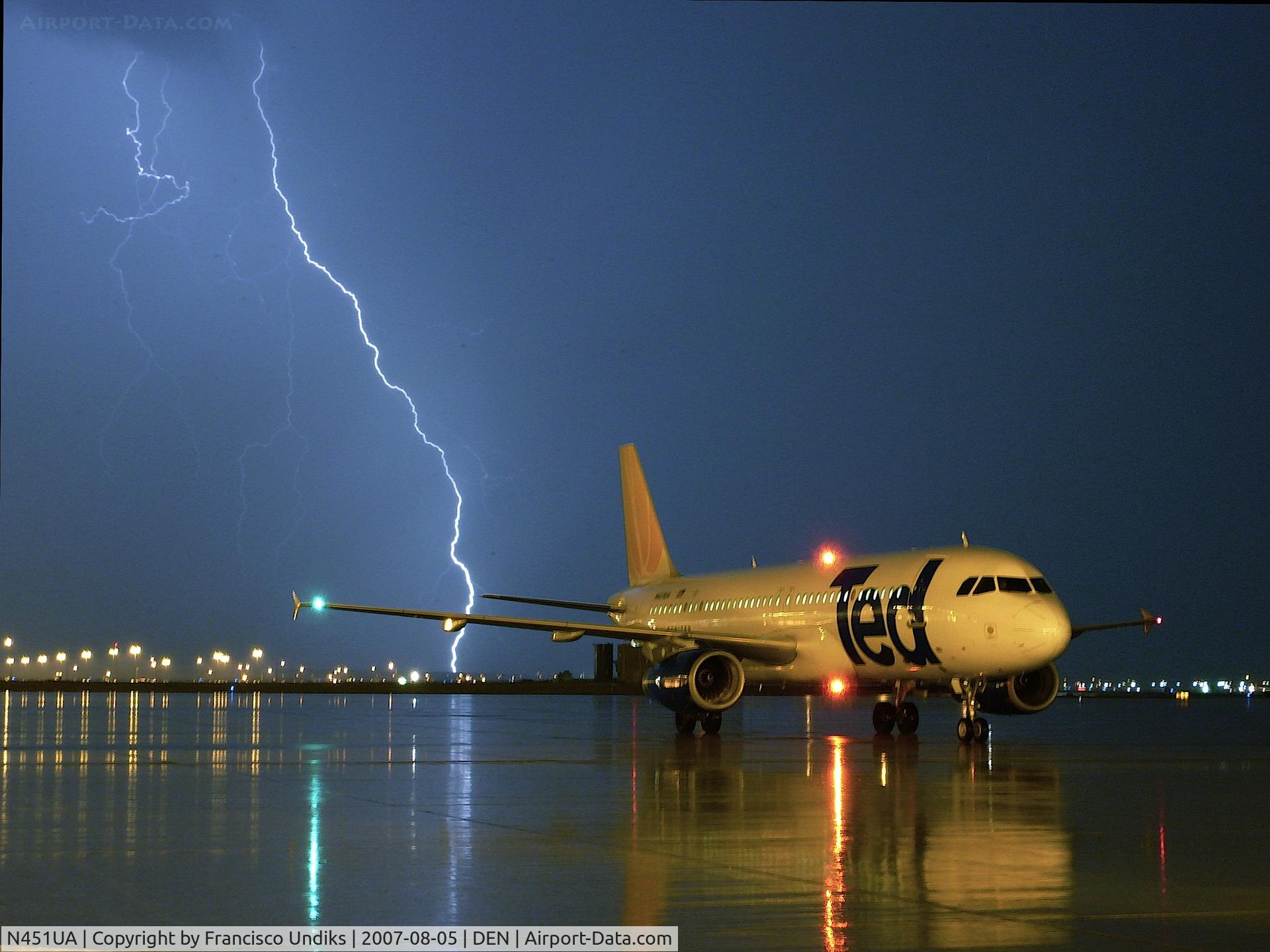 N451UA, 1998 Airbus A320-232 C/N 865, Ted A320 waiting for clearence during nasty thunderstorm.