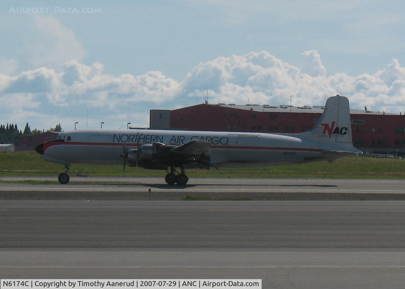 N6174C, 1954 Douglas DC-6A C/N 44075, Landing Anchorage.  I just stepped out of the N883EA at Anchorage and caught this DC-6 landing