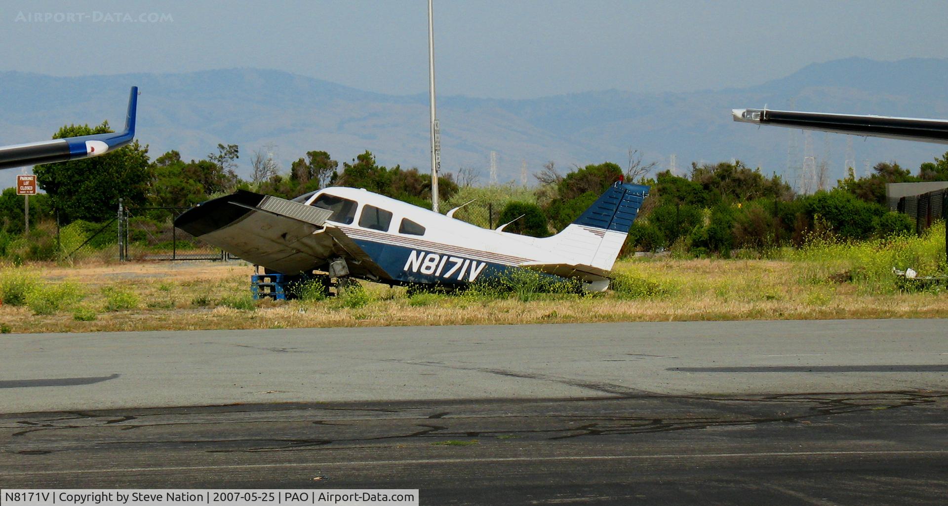 N8171V, 1980 Piper PA-28-161 C/N 28-8016282, Crumpled 1980 Piper PA-28-161 still waiting repairs @ Palo Alto, CA