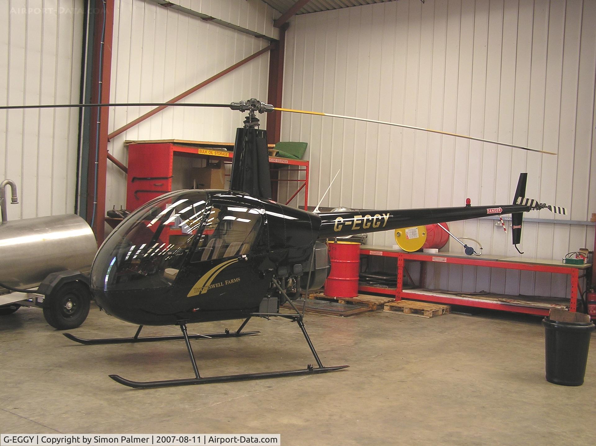G-EGGY, 2003 Robinson R22 Beta C/N 3452, R22 in the hangar at Wellesbourne