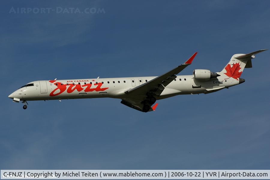 C-FNJZ, 2005 Canadair CRJ-705ER (CL-600-2D15) Regional Jet C/N 15046, From Air Canada Jazz landing on runway 26R
