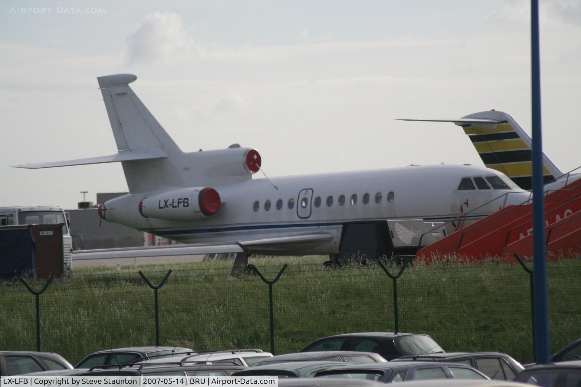 LX-LFB, 1990 Dassault Falcon 900 C/N 62, Taken from inside a coach at Brussels Airport