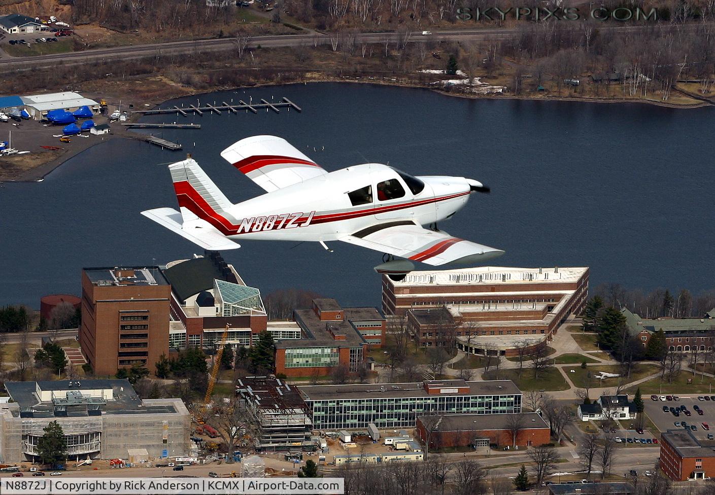 N8872J, 1965 Piper PA-28-180 C/N 28-2844, Piper N8872J flying low past Michigan Tech University