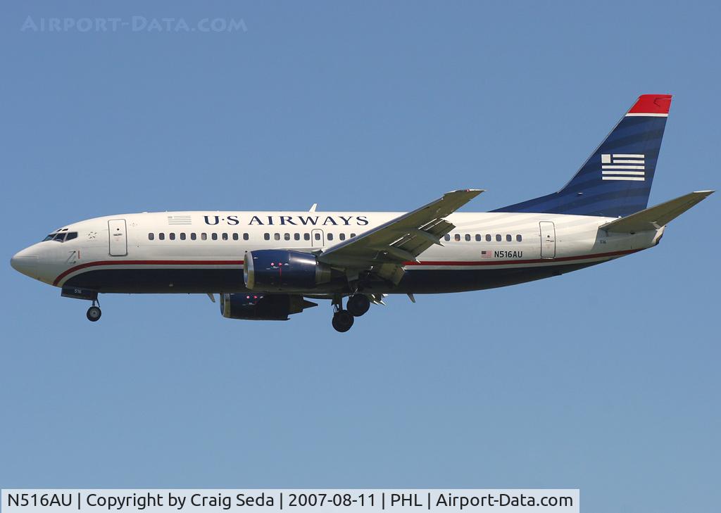 N516AU, 1987 Boeing 737-3B7 C/N 23702, Short final for rw 27R.