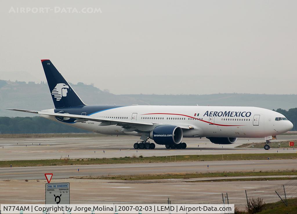 N774AM, 2001 Boeing 777-2Q8ER C/N 28689, Vacating RWY 33L after landing.