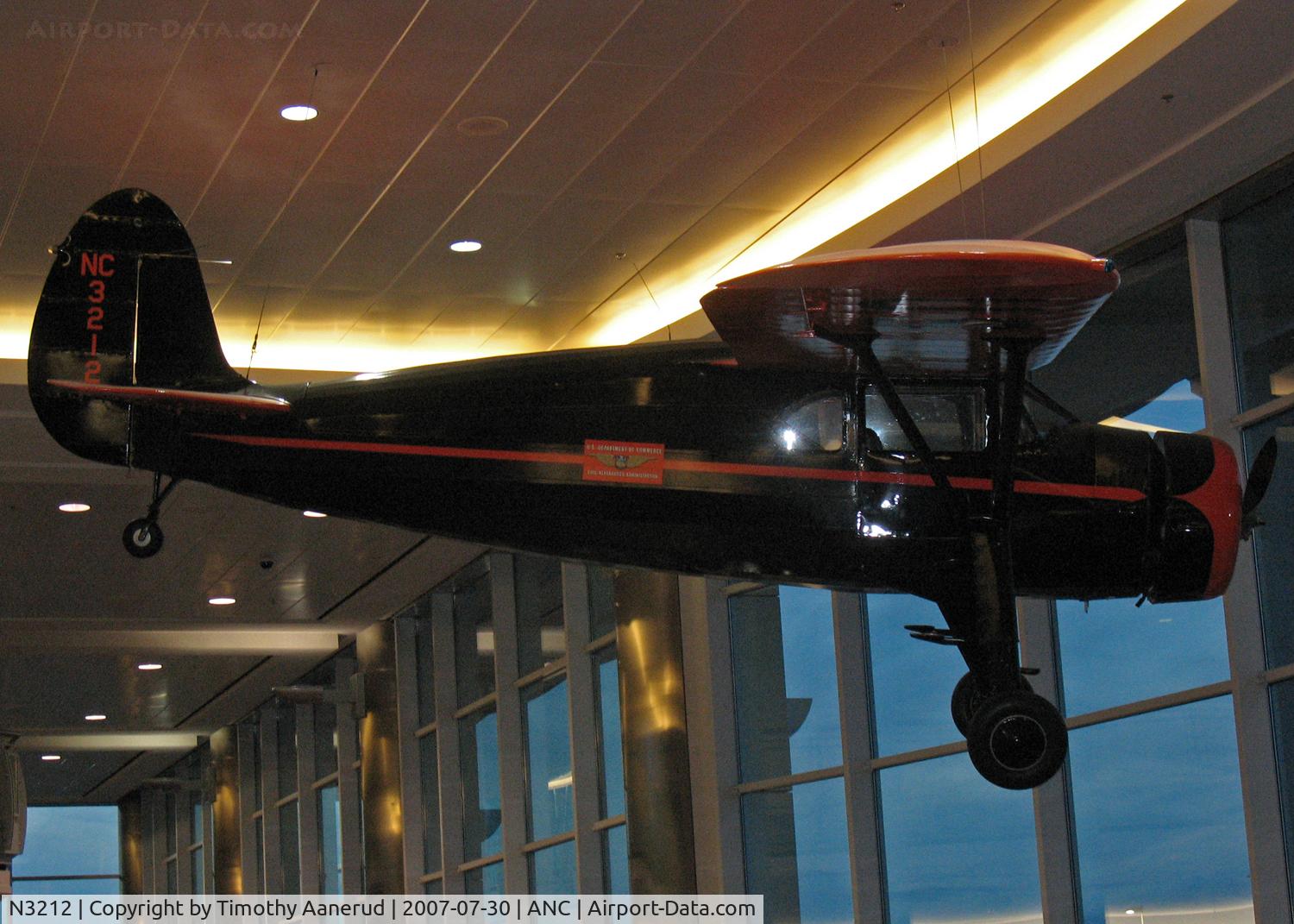 N3212, 1938 Fairchild 24 G C/N 2933, Hanging in the Terminal near gates C7-C9