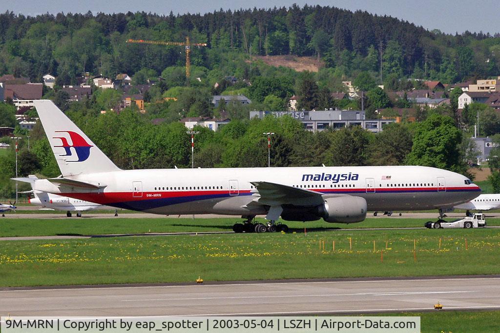 9M-MRN, 2002 Boeing 777-2H6/ER C/N 28419, towing a/c to the gate