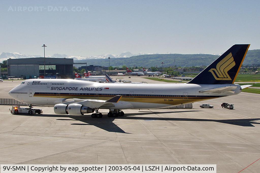 9V-SMN, 1992 Boeing 747-412 C/N 26548, towing the a/c to the gate